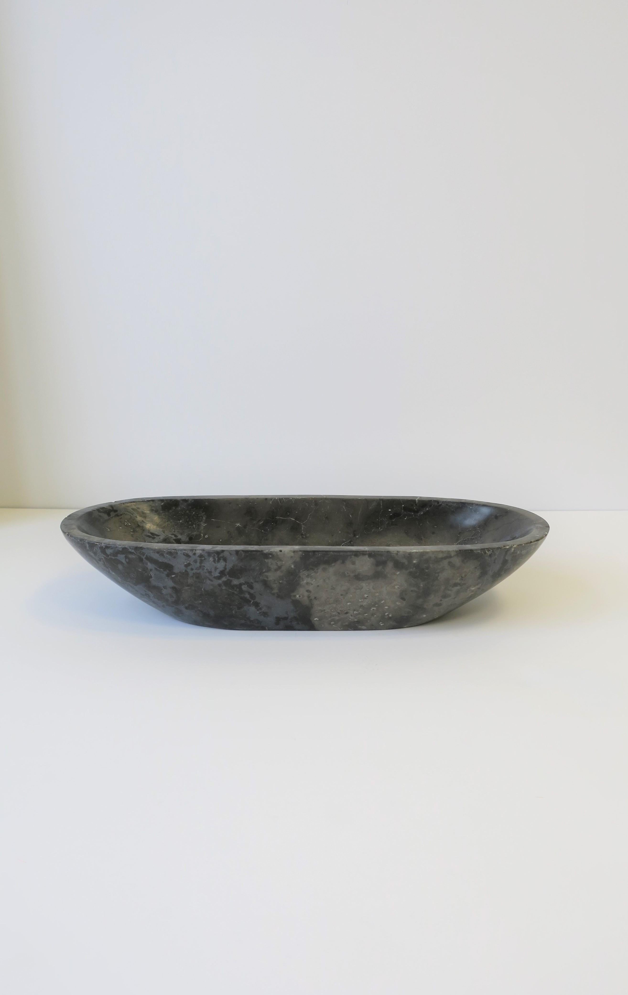 A substantial blue or grey stone oblong bowl or vide-poche (catch-all) in the Minimalist style. 

Piece measures: 3