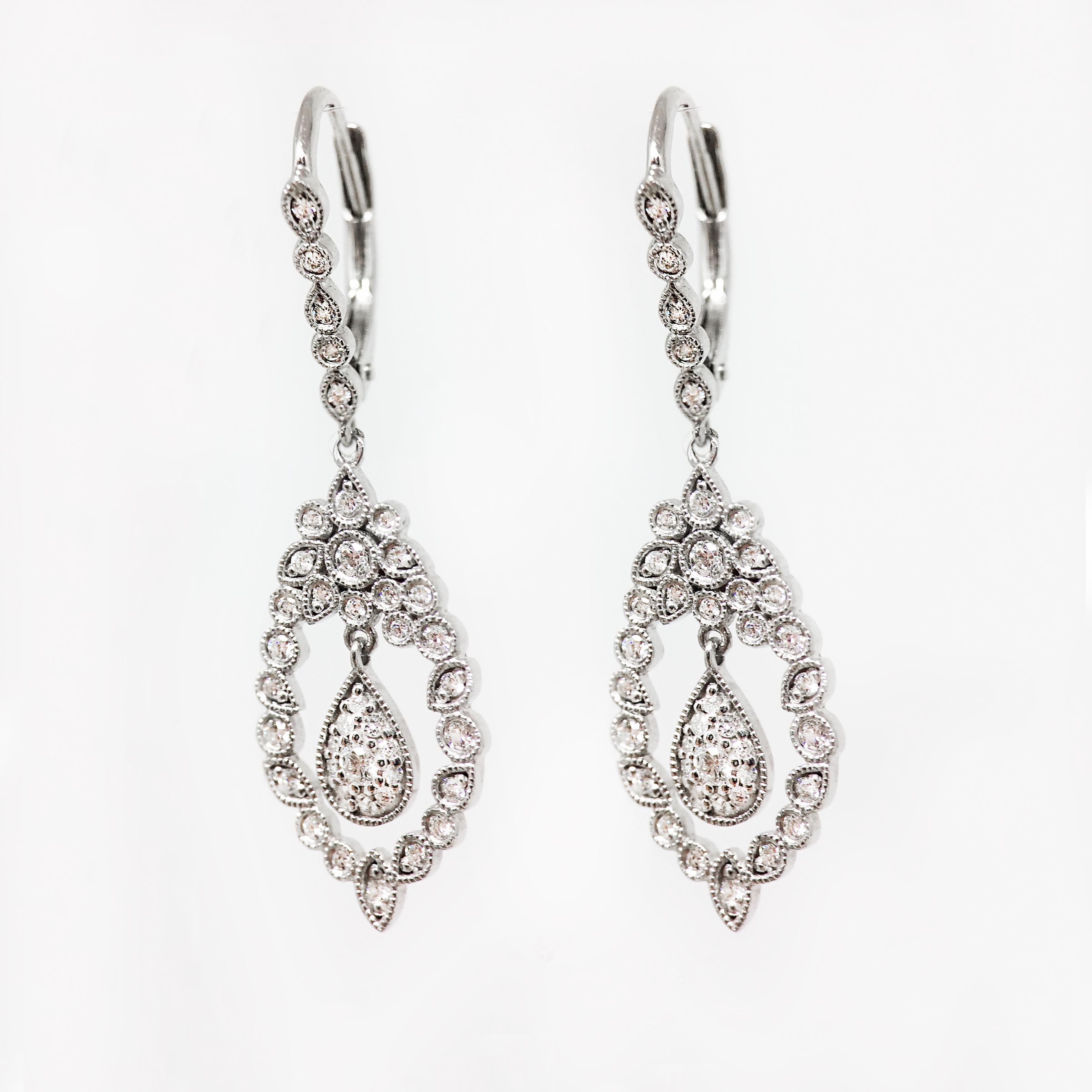 By Stone Paris

Dangle earrings
18-kt white gold 3.20g
82 GVS white diamonds 0.43 ct
Dormeuse system - Length : 2.74 cm
Size of the pattern : 0.94 x 1.74 cm

This jewel is also available in pink gold, black gold, and yellow gold.
For more