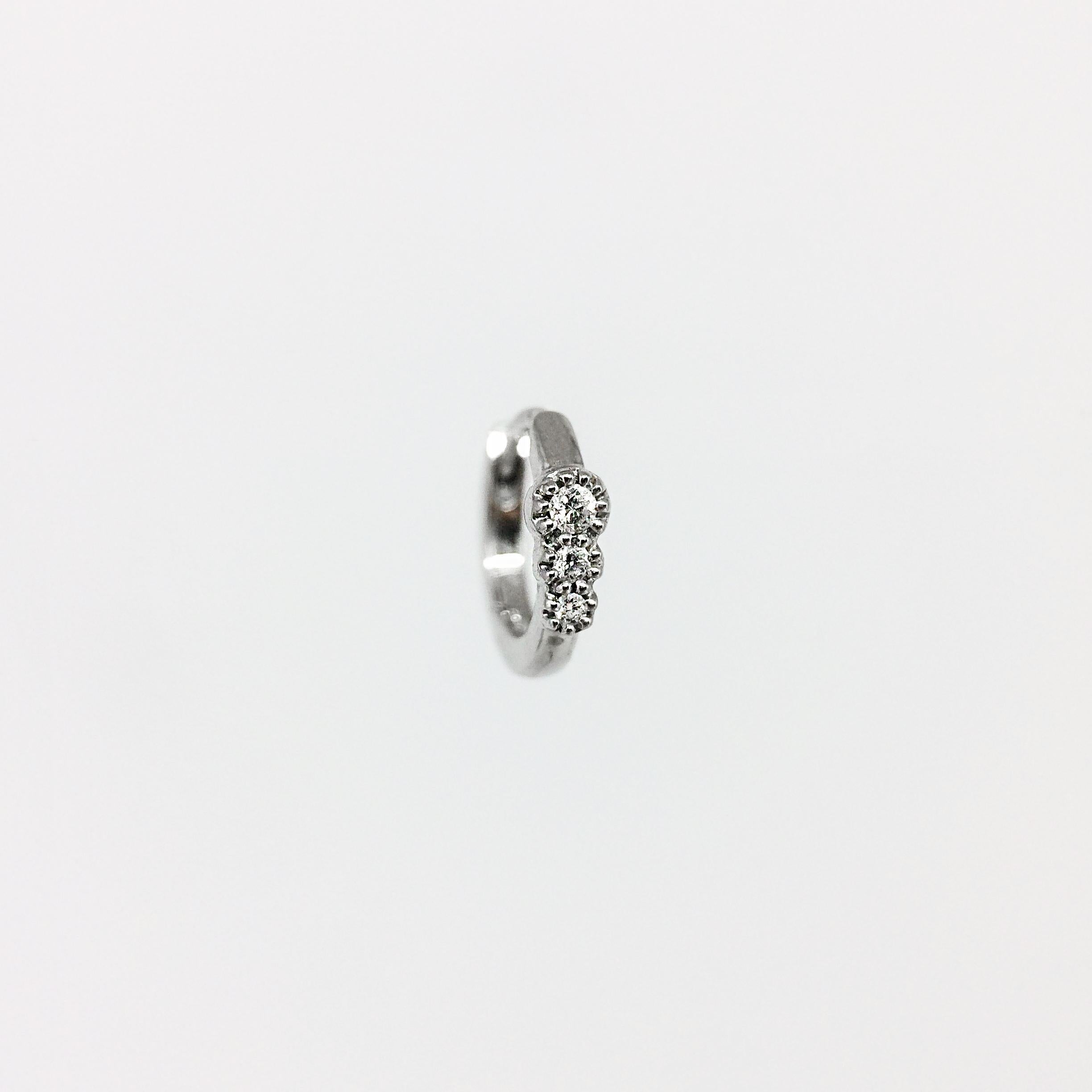 By Stone Paris

Tiny hoop
18-kt white gold 0.65 g
3 GVS white diamonds 0.03 ct
Inner diameter : 0.65 cm - Sold singly

This piece is unavailable, it has to be especially handmade with an 8 to 10 weeks lead time. 
All products made to order cannot be