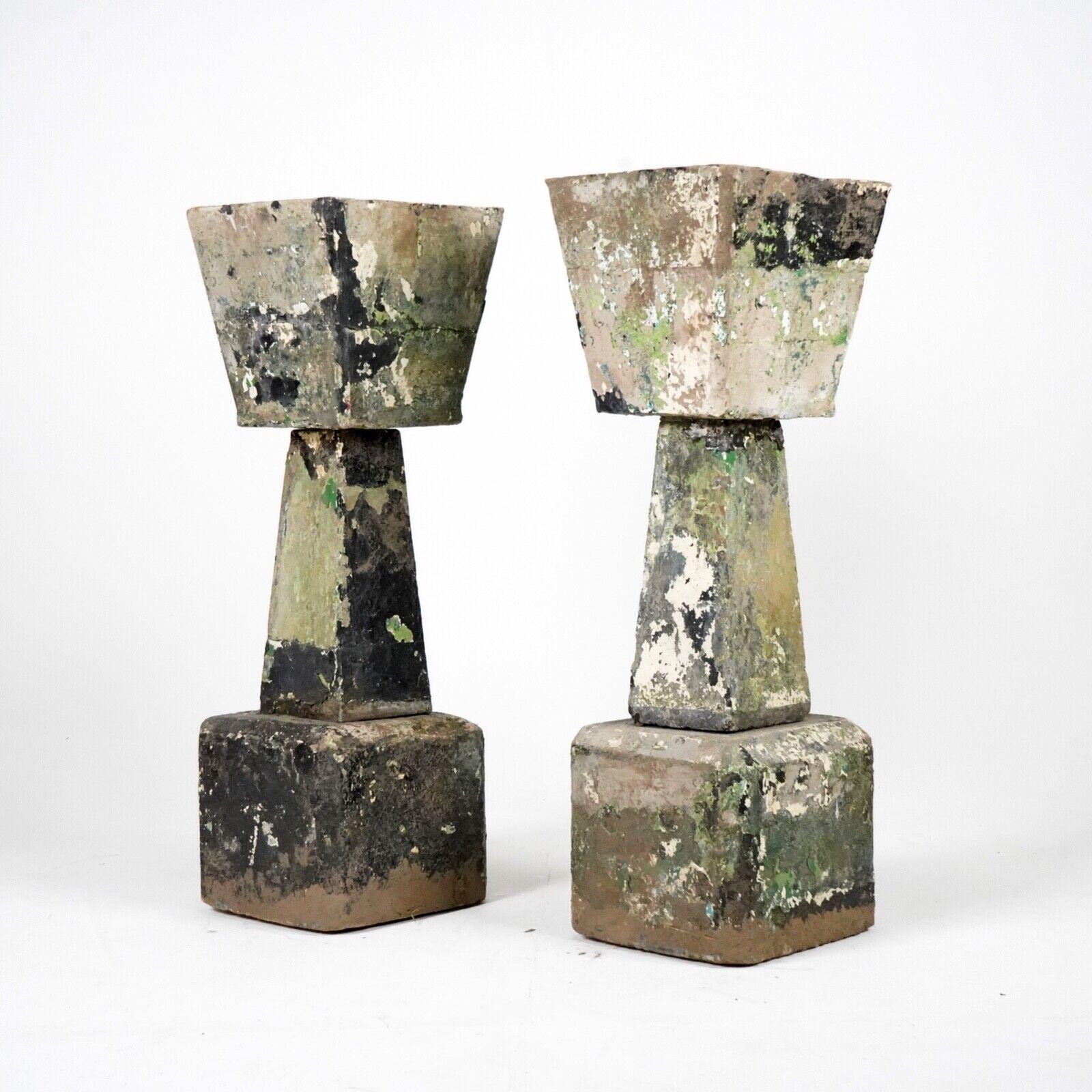 A great pair of monumental stone planters. With strong angular shape and excellent patina in green, blacks and whites. A striking pair that are extreme heavy.  

Dimensions
H 98cm, W 33cm D 33cm 
 
Condition 
Please do take a careful look at all our