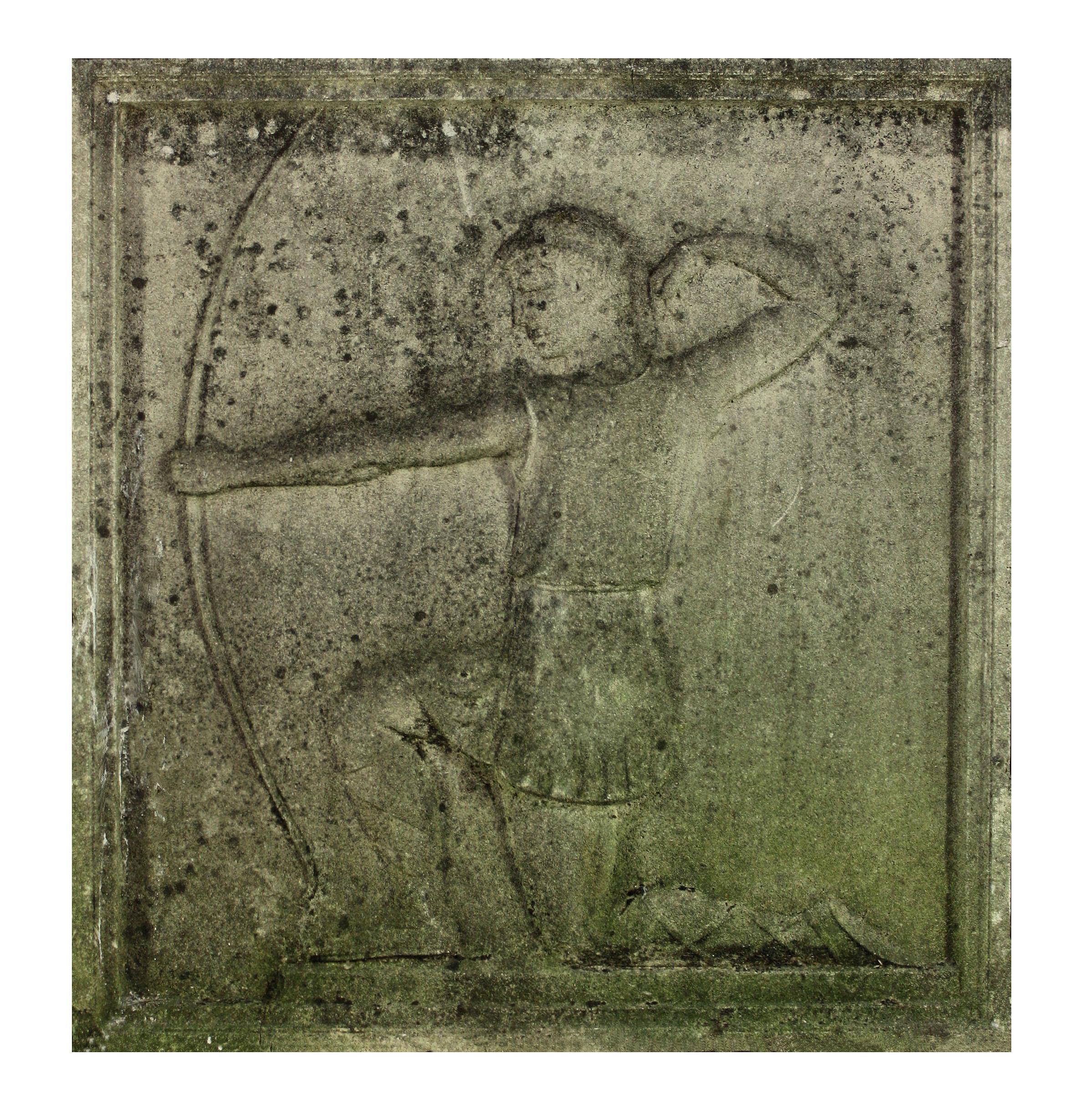An English stone relief plaque depicting a classical archer.