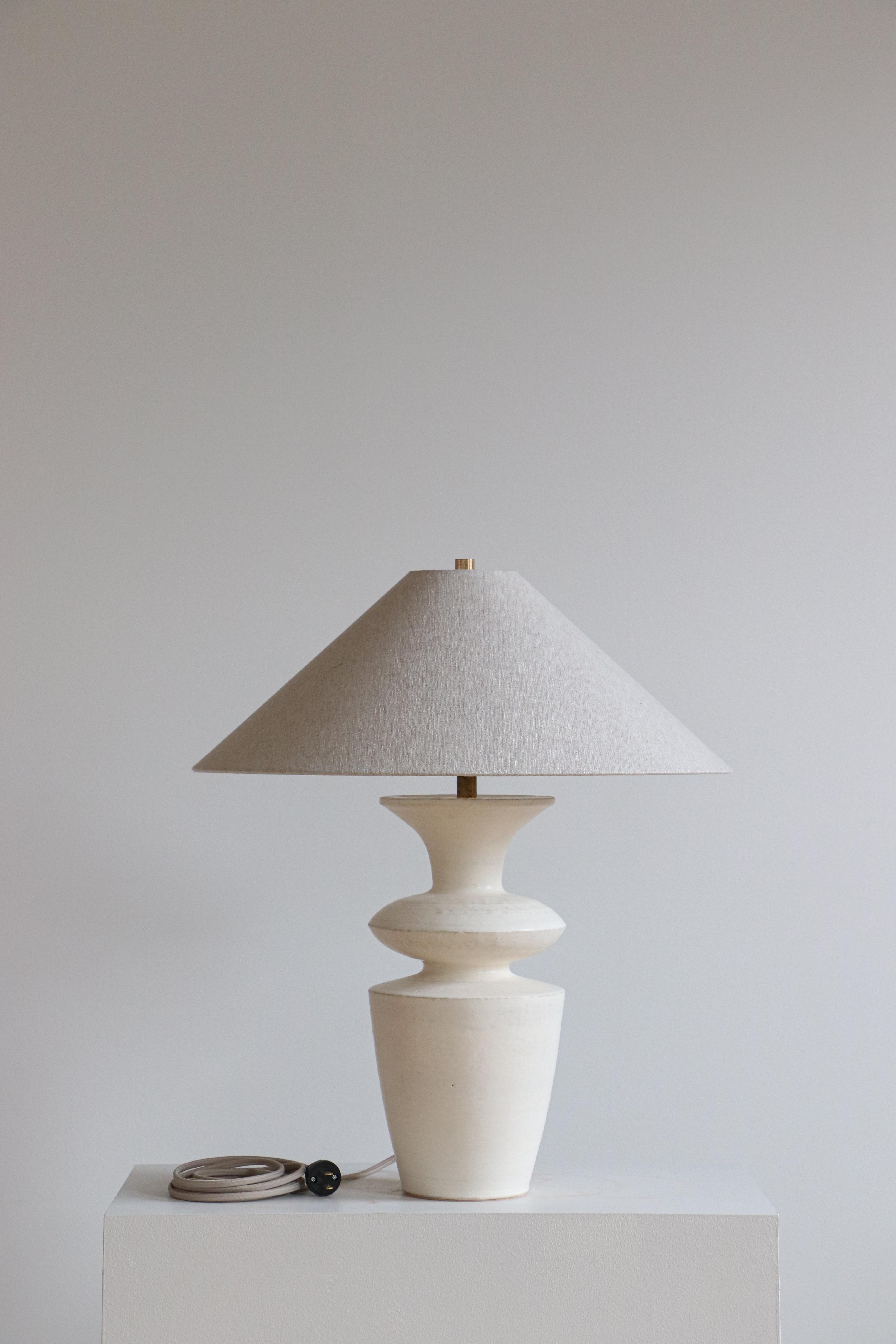 Stone Rhodes Table Lamp by Danny Kaplan Studio
Dimensions: ⌀ 51 x H 69 cm
Materials: Glazed Ceramic, Unfinished Brass, Linen

This item is handmade, and may exhibit variability within the same piece. We do our best to maintain a consistent product,