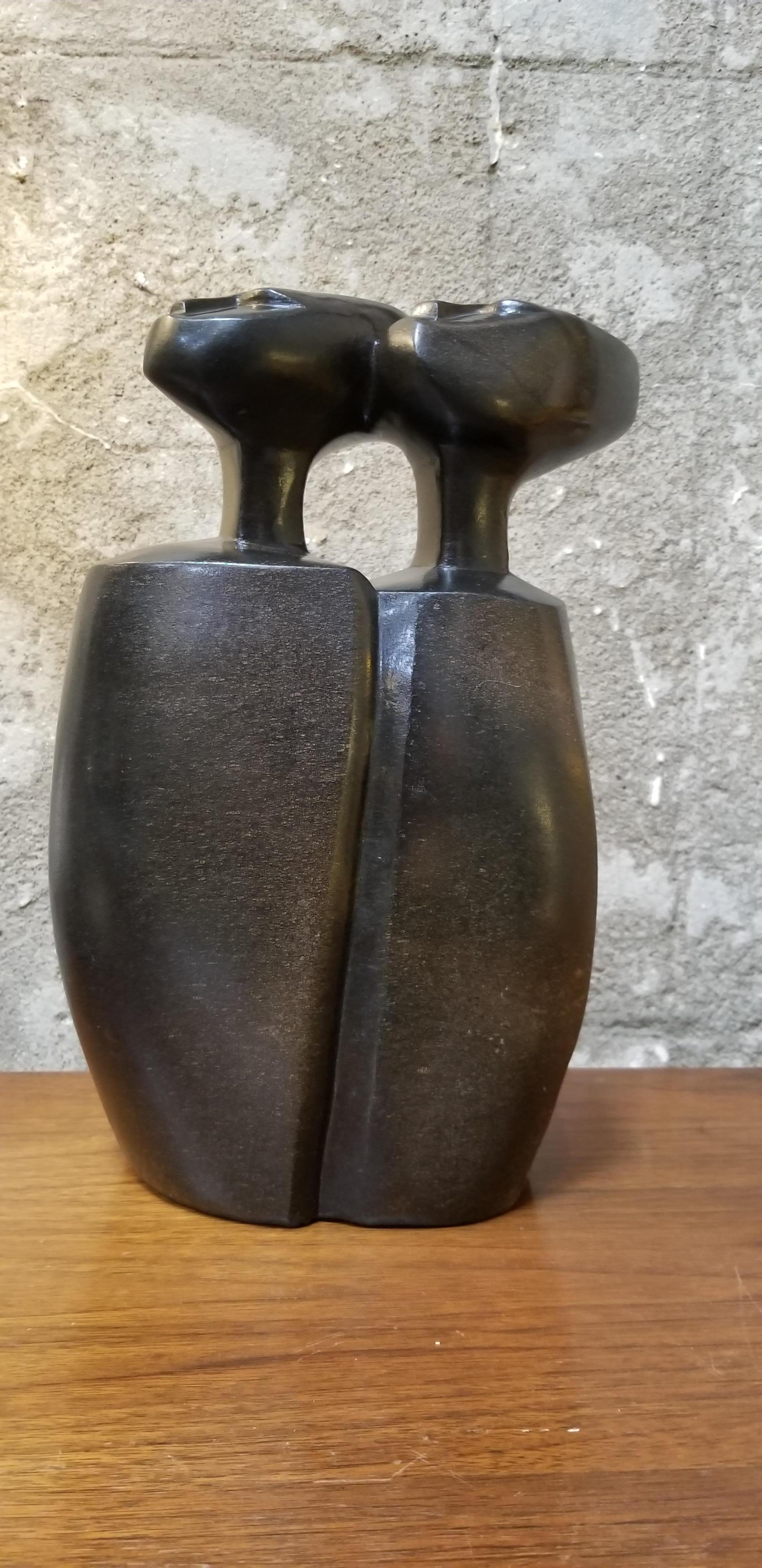 Shona sculpture of a man and woman carved in Springstone by Nicholas Mukomberanwa. Signed at base.
Nicholas Mukomberanwa (1940-12 November 2002) was a Zimbabwean sculptor and art teacher. He was among the most famous products of the workshop school