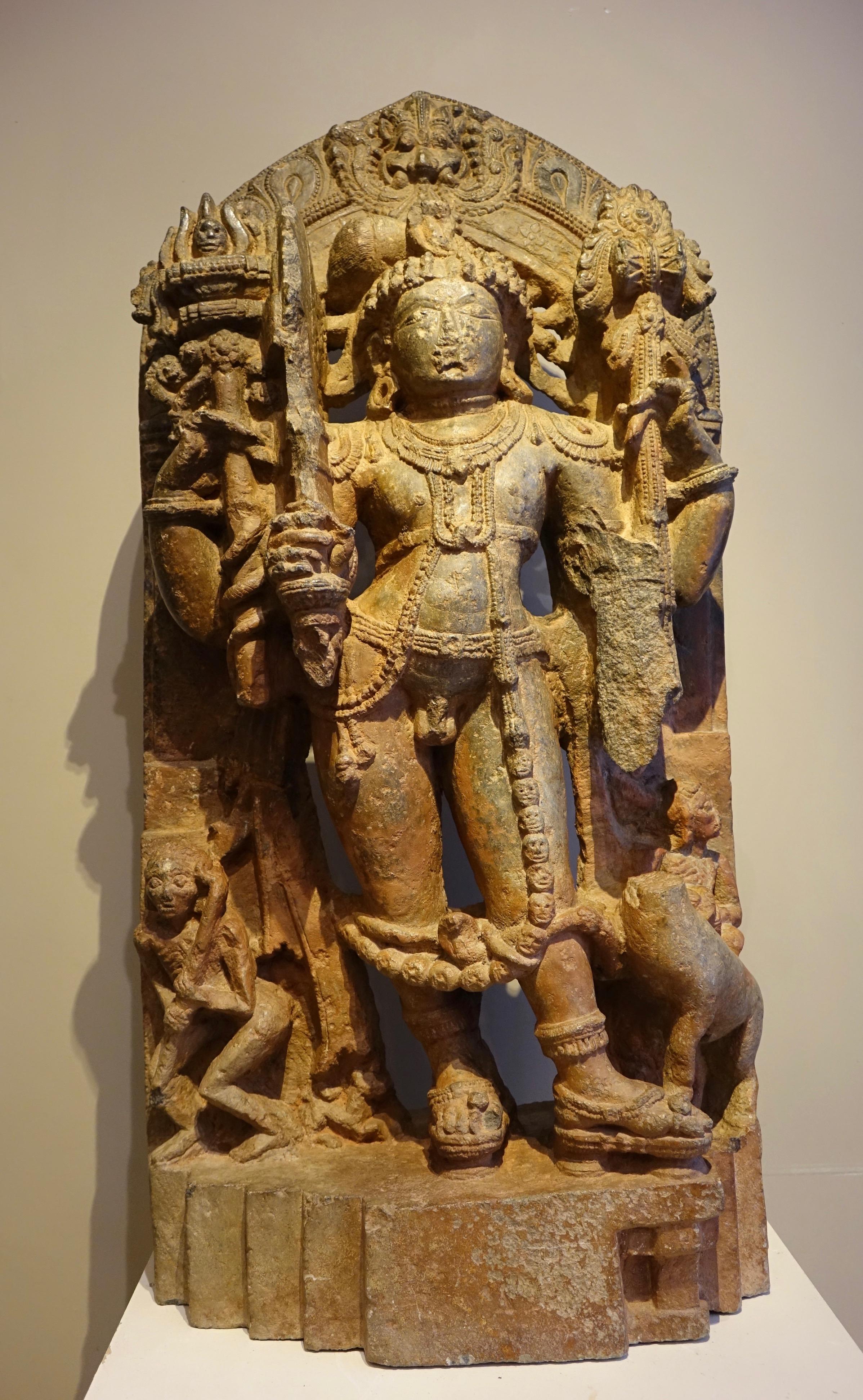 Stele in serpentine stone representing Shiva Hindu god, member of the Trimurti, with Brahma and Vishnu. He is the creator, the preserver, the transformer, the concealer, and the revealer, in the Shivaist tradition of Hinduism. Represented with a 3rd