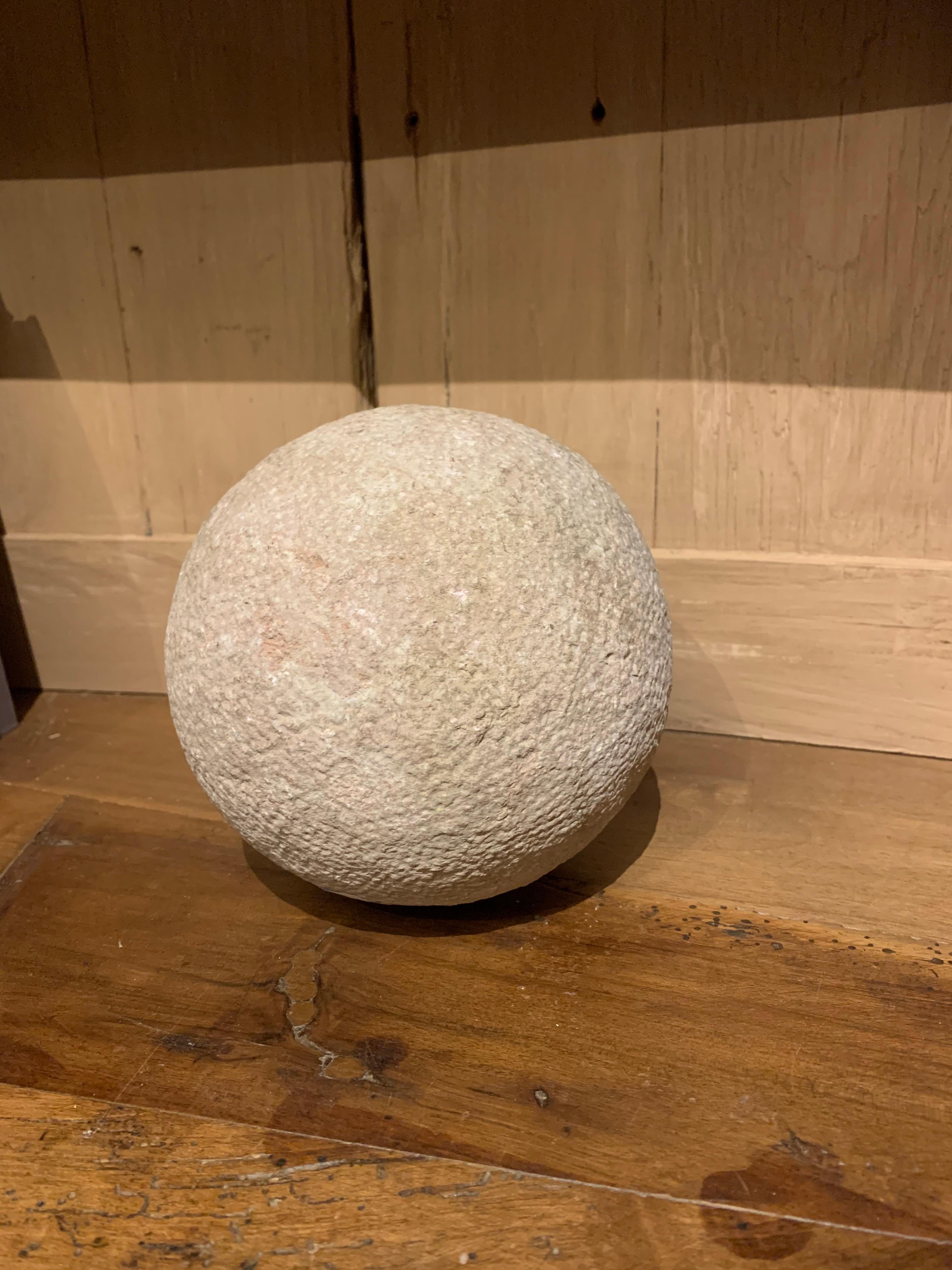 A 19th century French sandstone sphere. The surface finished in so called 'Bouchardé' with old marks and some corrosion stains. Overall nice patina.
Spheres like this were often made by apprentice stonecutters as a exercise and sold as garden- or