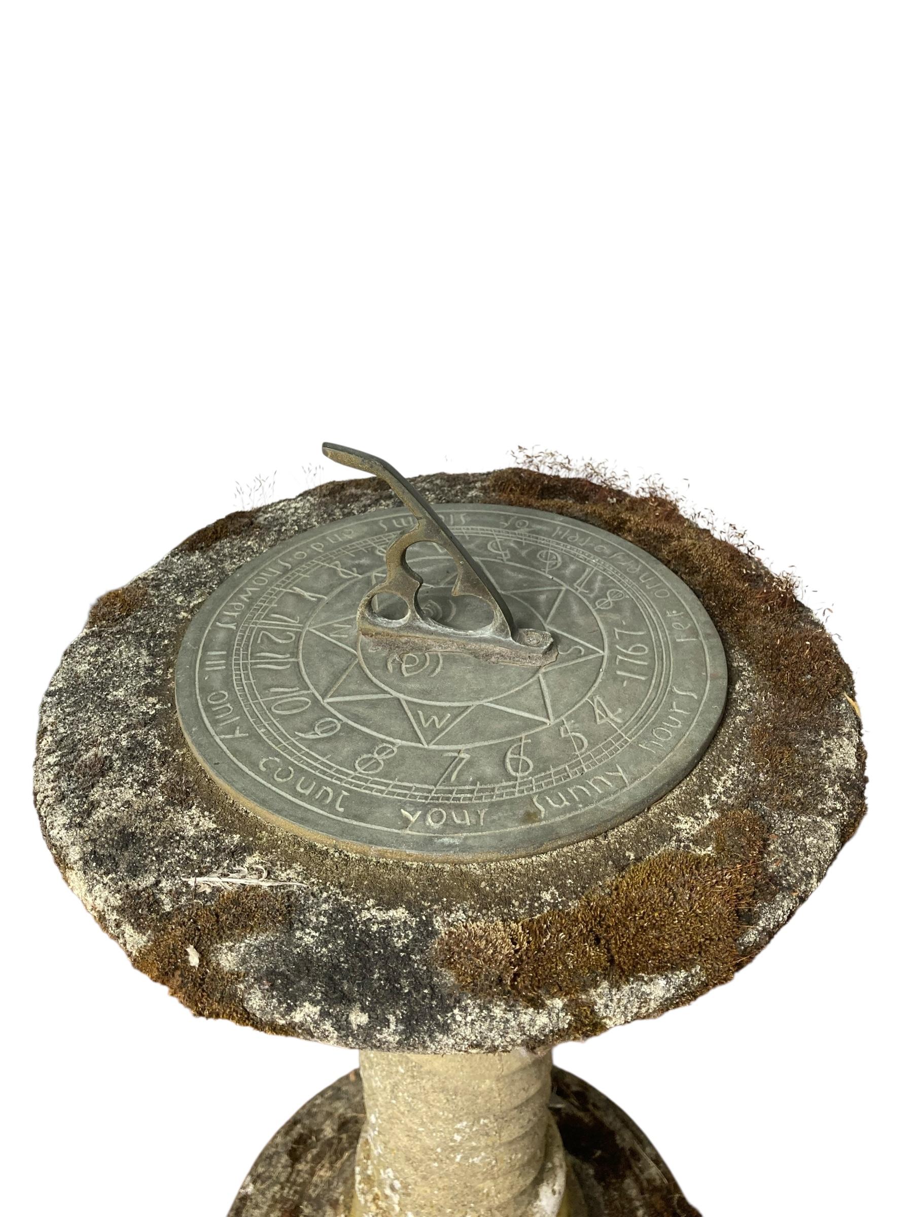 Stone Sundial with Barley Twist Style Column with Natural Patina Inscribed Wording on dial 'Others so tell of Storms and Showers Only Count Yor Sunny Hours'. Its natural stone finish complements a variety of styles, making it an ideal addition to