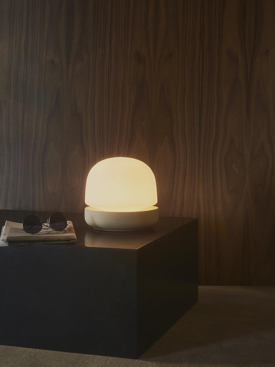Stone Lamp adds more than just light to a room, it casts a beautiful soft glow. Danish duo Norm Architects set out to reexamine the lamp, with the intention of designing a piece to light the home like candlelight. The considered use of natural