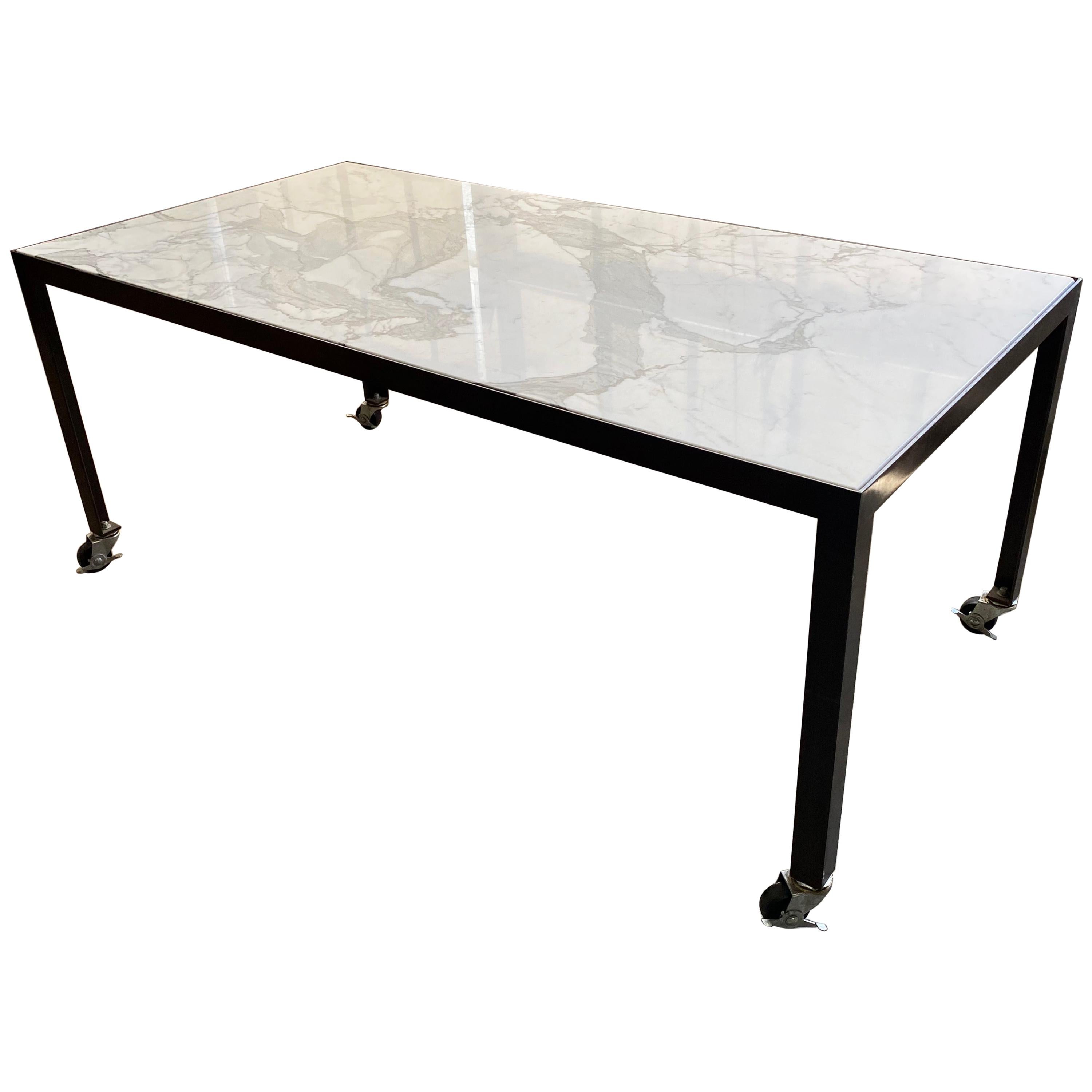 Originally designed by Javier Robles for meetings, this mobile table can be used either in the home or workplace.

Custom made by local New York artisans.

Finishes
Calacatta marble
Blackened steel.
 