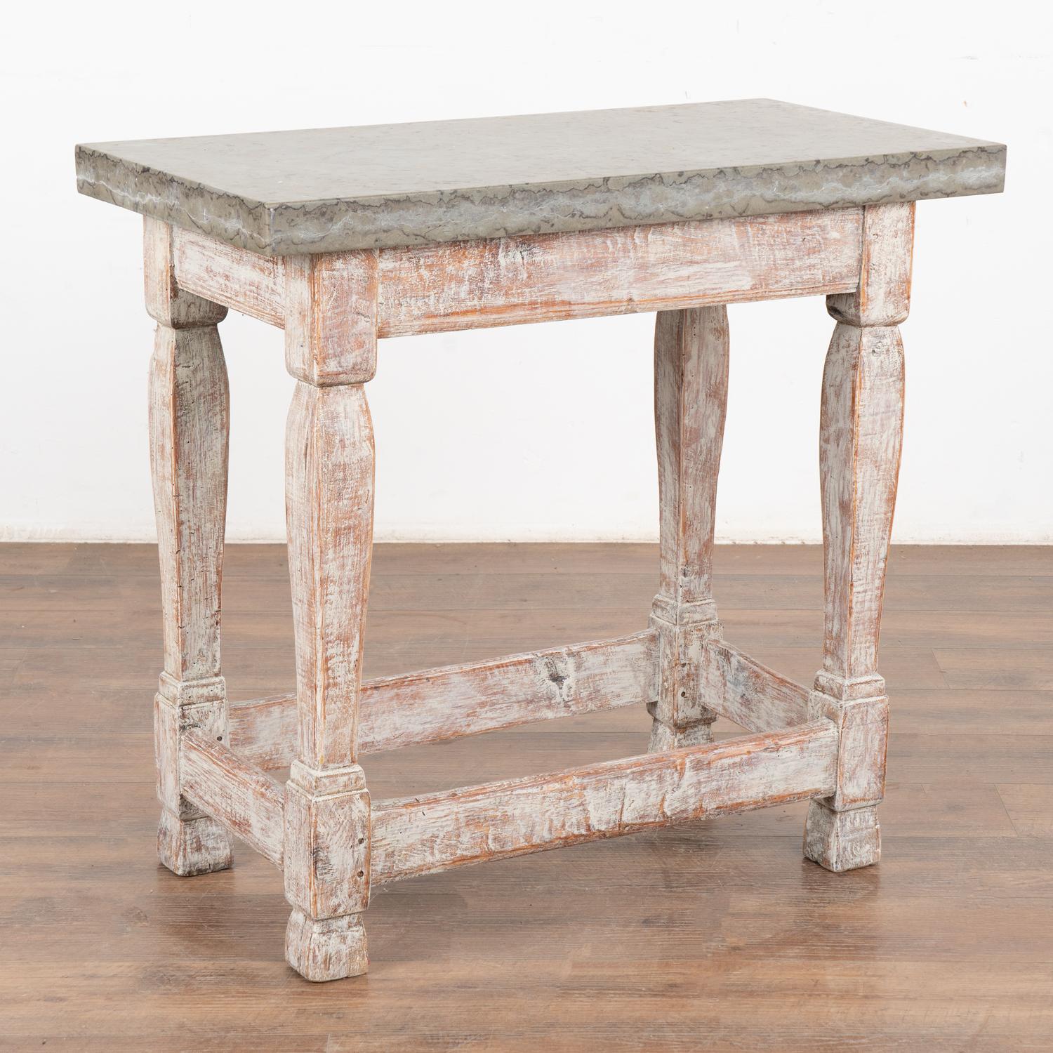 Swedish console table with stunning stone top resting on heavy baroque legs.
Please refer to the close up photos to appreciate the natural beauty of the stone top.
Restored, the strong table base is painted with a newer white finish, distressed