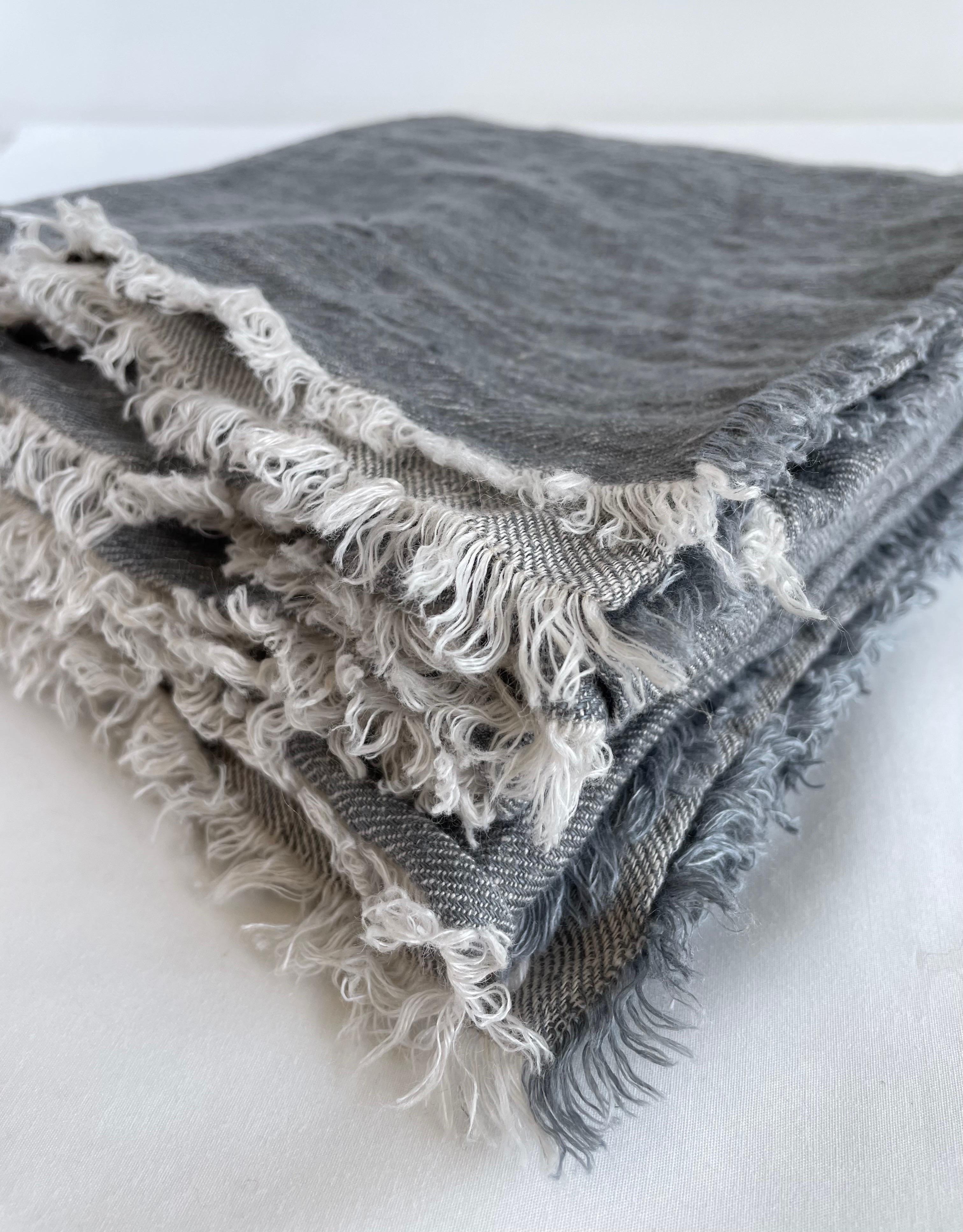 Layer your sofa or bed with this washed Belgian linen throw imported from Paris, France. In the colour Nude-Givre (blush), which is a natural color with blush tones.  The decorative frayed edge give this a relaxed look. If this item is backordered,