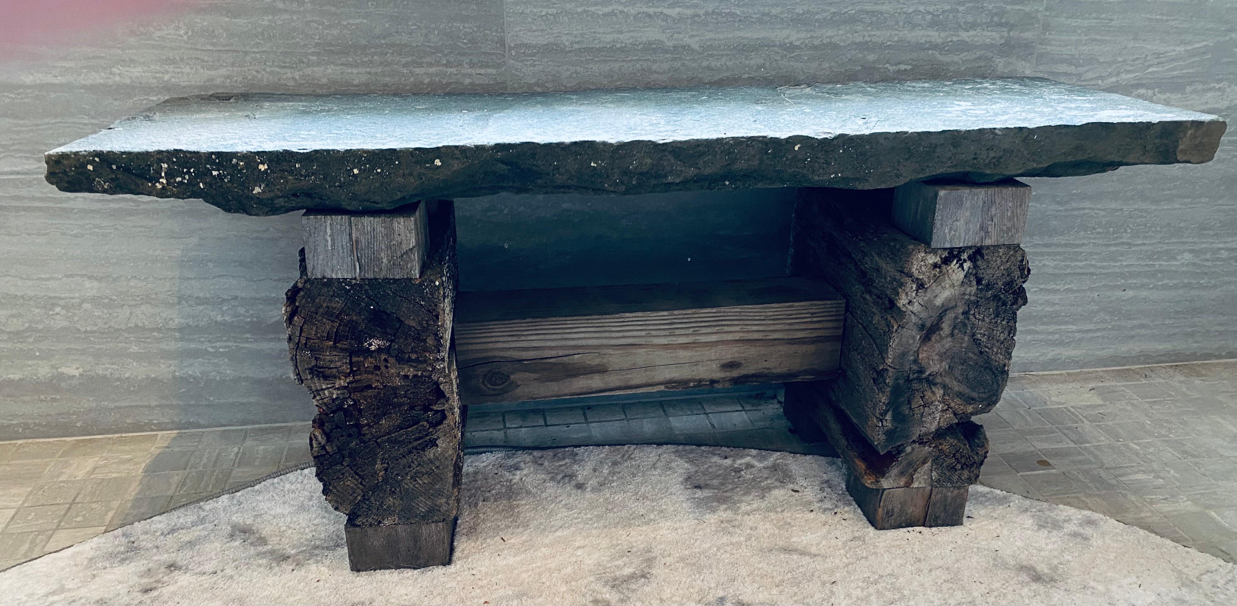 Integration of stone and reclaimed lumber in a Japanese style creates an immediate feel of weight and time. The bench offers a place to rest when slipping on a pair of comfortable slippers, or drying oneself after a hot bath. Allow us to build you