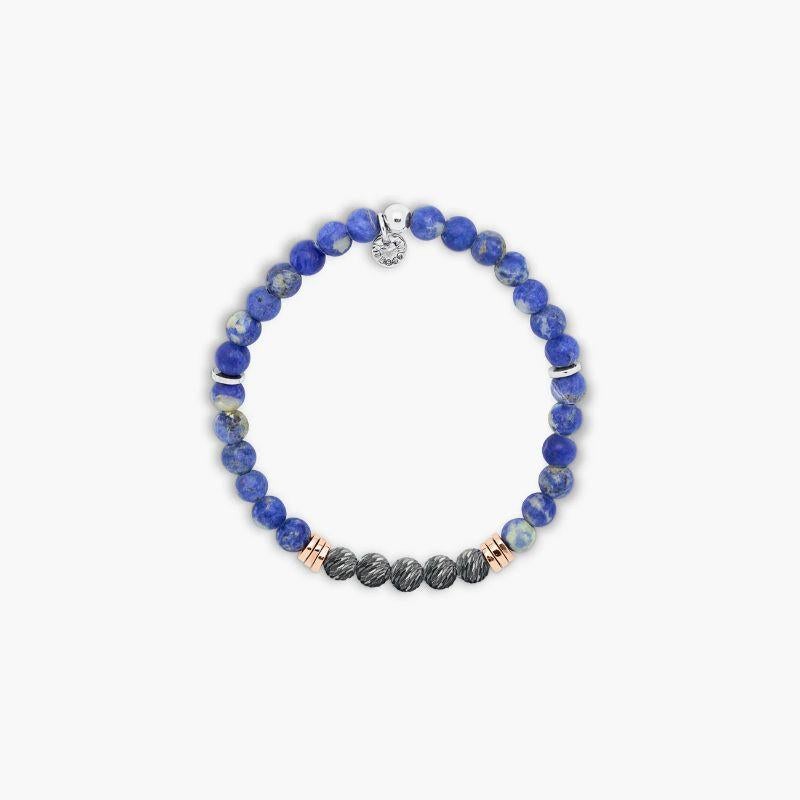 Stonehenge Bracelet with Sodalite in Sterling Silver, Size M

Sodalite beads are paired with 2-microns rose gold-plated sterling silver discs and 5 black rhodium-plated sterling silver beads, each crafted and carved by hand to create a unique and