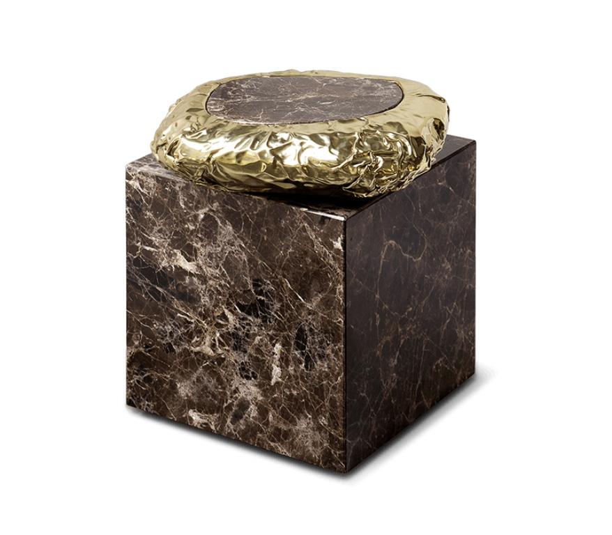 Finding inspiration in the prehistoric monument Stonehenge, positioned asymmetrically and composed by a striking variety of finishes and materials – brass and marble. This piece promises to elevate your living space to the next level. The metallic