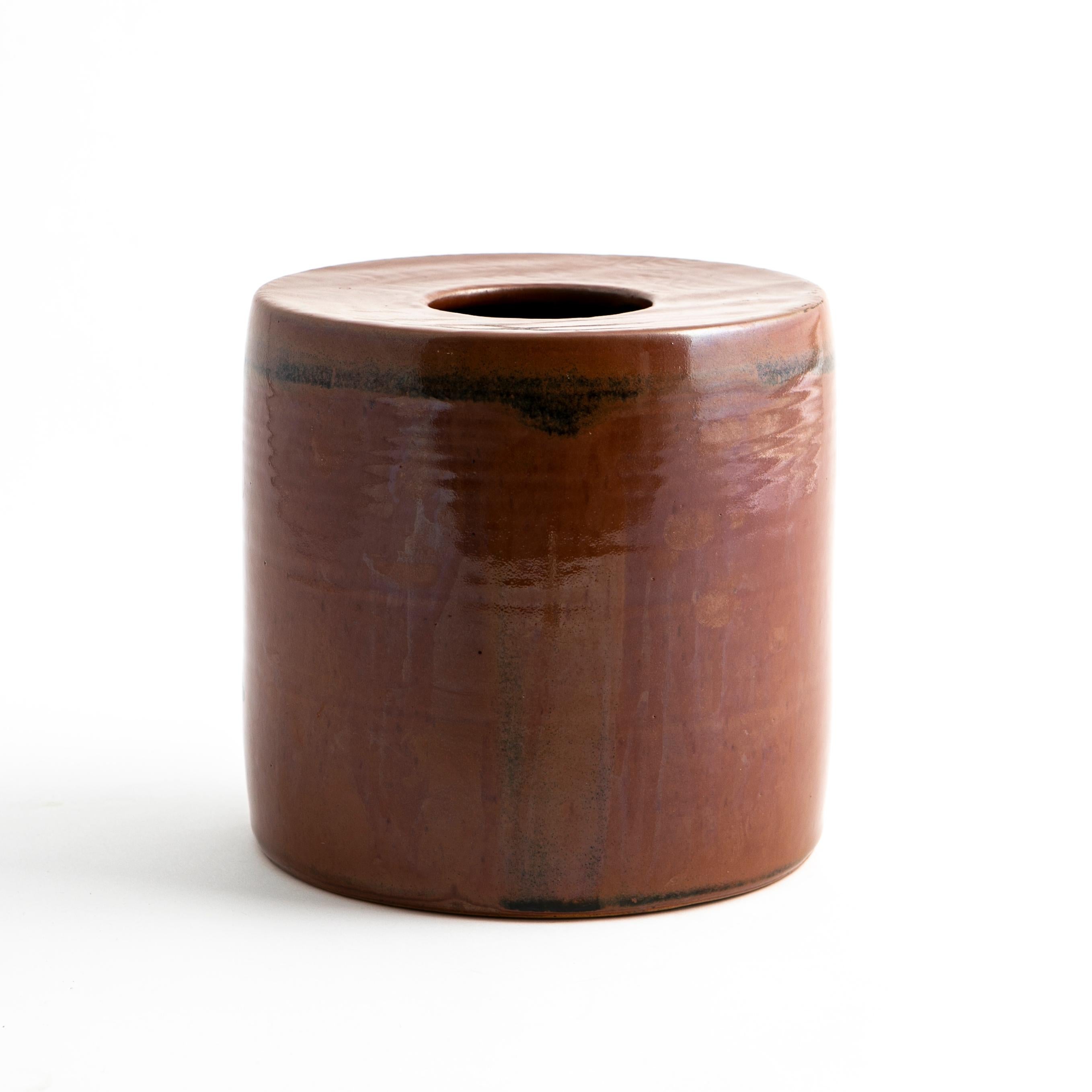 Jacob Bang, Danish 1932-2011
Vintage midcentury Scandinavian vase by Jacob Bang.
Cylinder form in maroon glazed stoneware with strokes in a darker glaze.
Designed by Jacob Bang in his own workshop, Denmark 1960s. Marked on base.


Jacob Bang