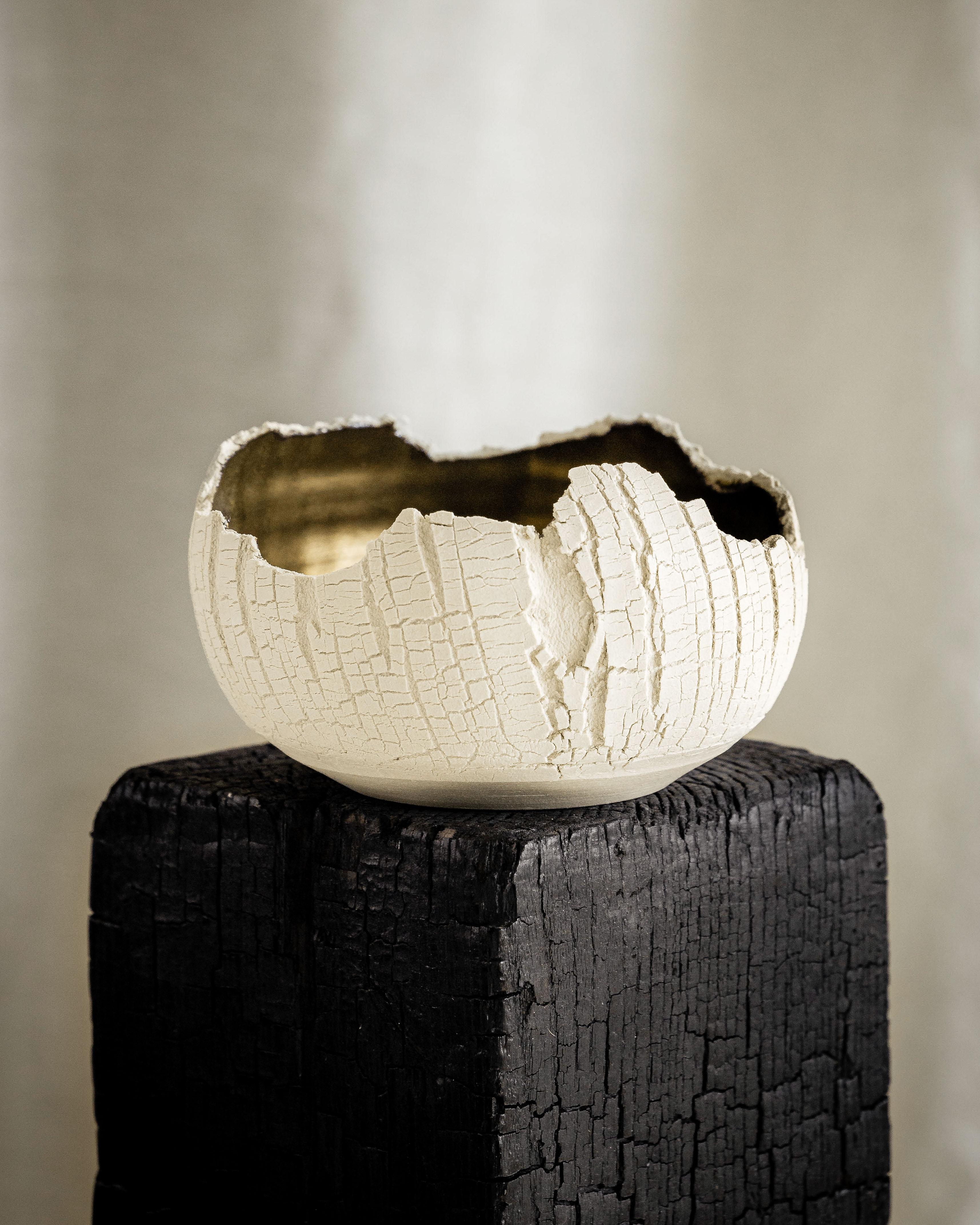 Stoneware and Bronze, Distressed Form NO.1  by Alexandria Roby
Dimensions: D 17.78 x H 10.16 cm
Materials: White stoneware lined with bronze glaze
Colors - Ivory, Sandstone, or Onyx

My first interaction with clay was in 2011 as an undergrad,