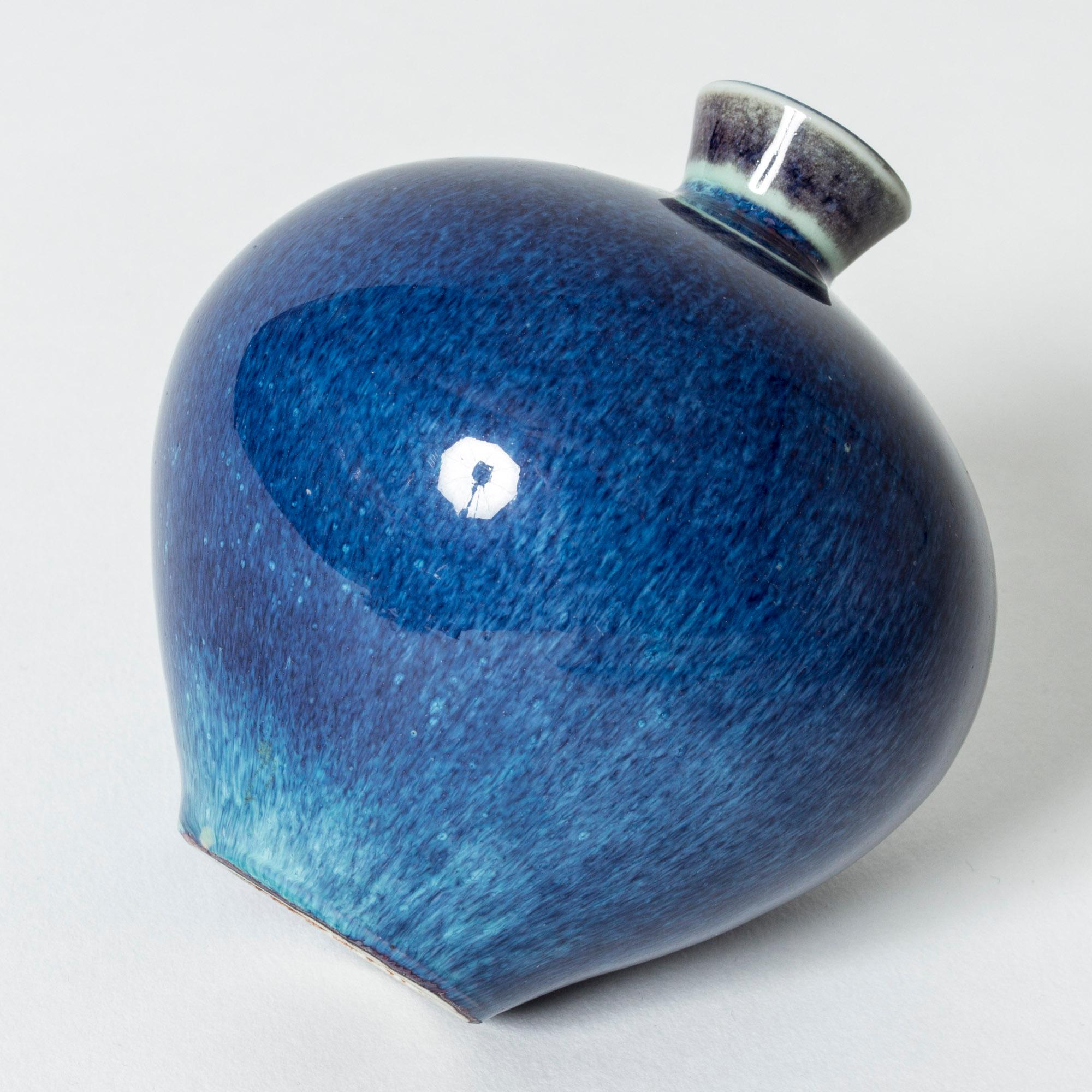 Small stoneware vase by Berndt Friberg, with intense blue “Aniara” glaze with aquamarine streaks. Lovely, plump form.