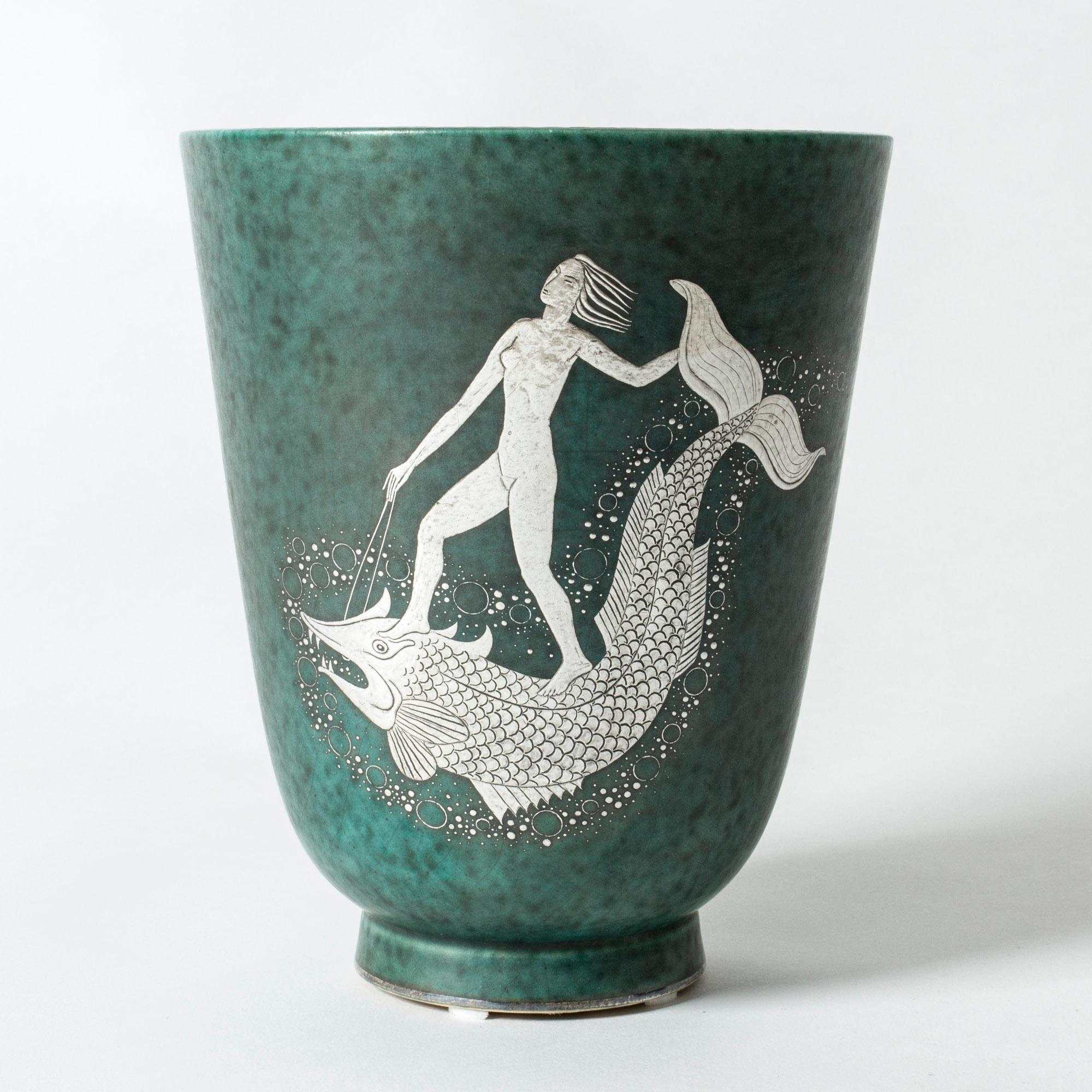 Stoneware “Argenta” vase by Wilhelm Kåge with an amazing silver decor of a woman riding on a fish. Lovely attention to every detail.

“Argenta” was introduced at the Stockholm exhibition in 1930 and became Wilhelm Kåge’s most widely appreciated