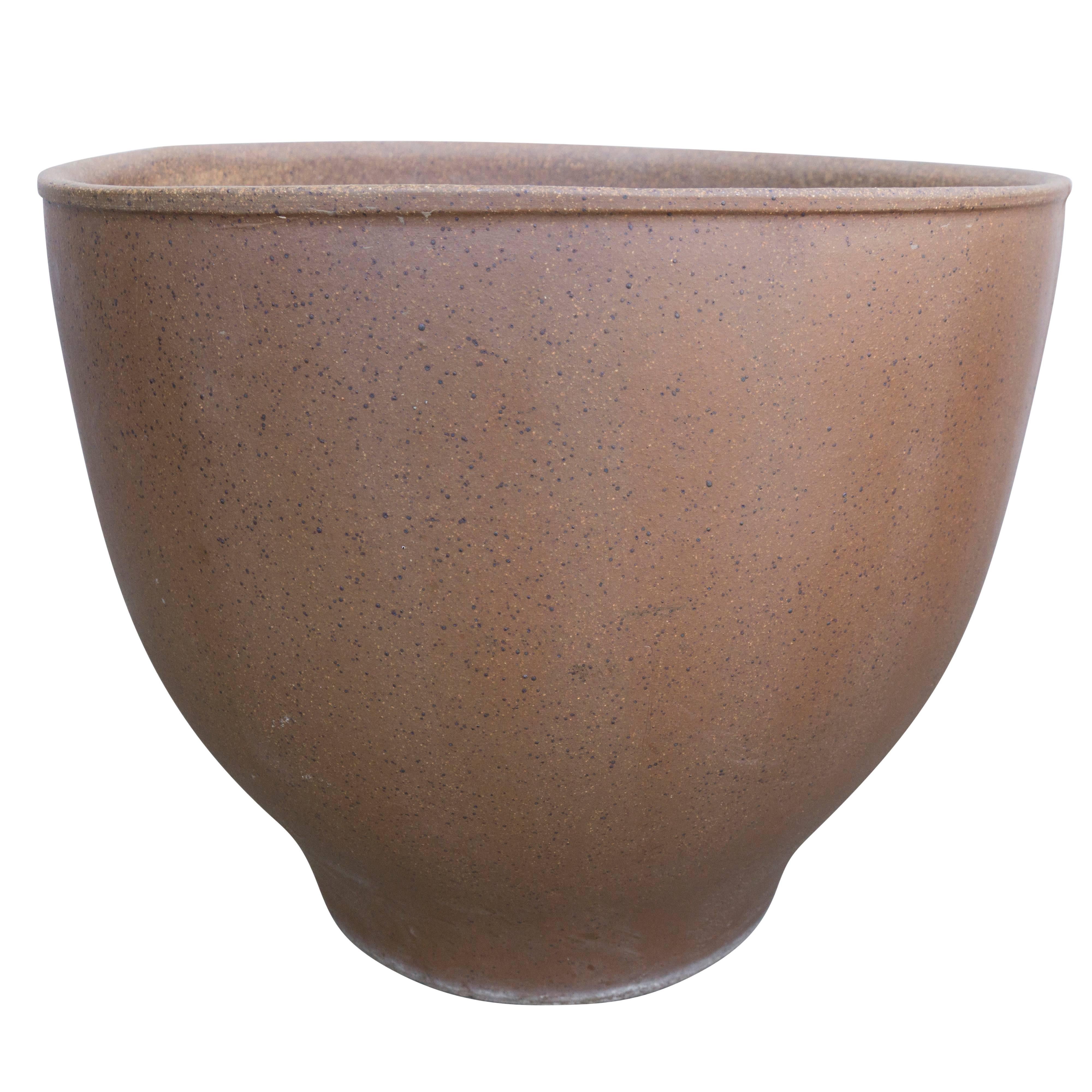 The stoneware natural speckled brown color seen in earth gender pottery on this glazed stoneware bell by California pottery icon David Cressey. The sleek bell shape and balance of this vessel makes it a visually delightful addition to a home or