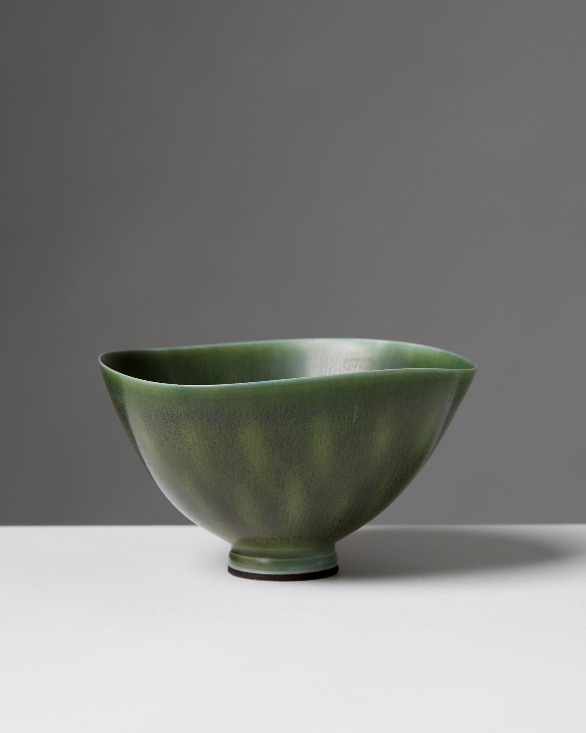 Bowl by Berndt Friberg for Gustavsberg,
Sweden, 1955.

Stoneware.

Berndt Friberg was born in the southern Sweden town of Hoganas. He came from a long line of ceramists, in an area steeped in the tradition of finely crafted pottery. Berndt started