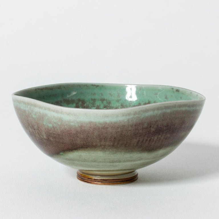 Beautiful miniature stoneware bowl by Berndt Friberg, glazed pale green and plum tones. Softly square form with an undulating edge.
