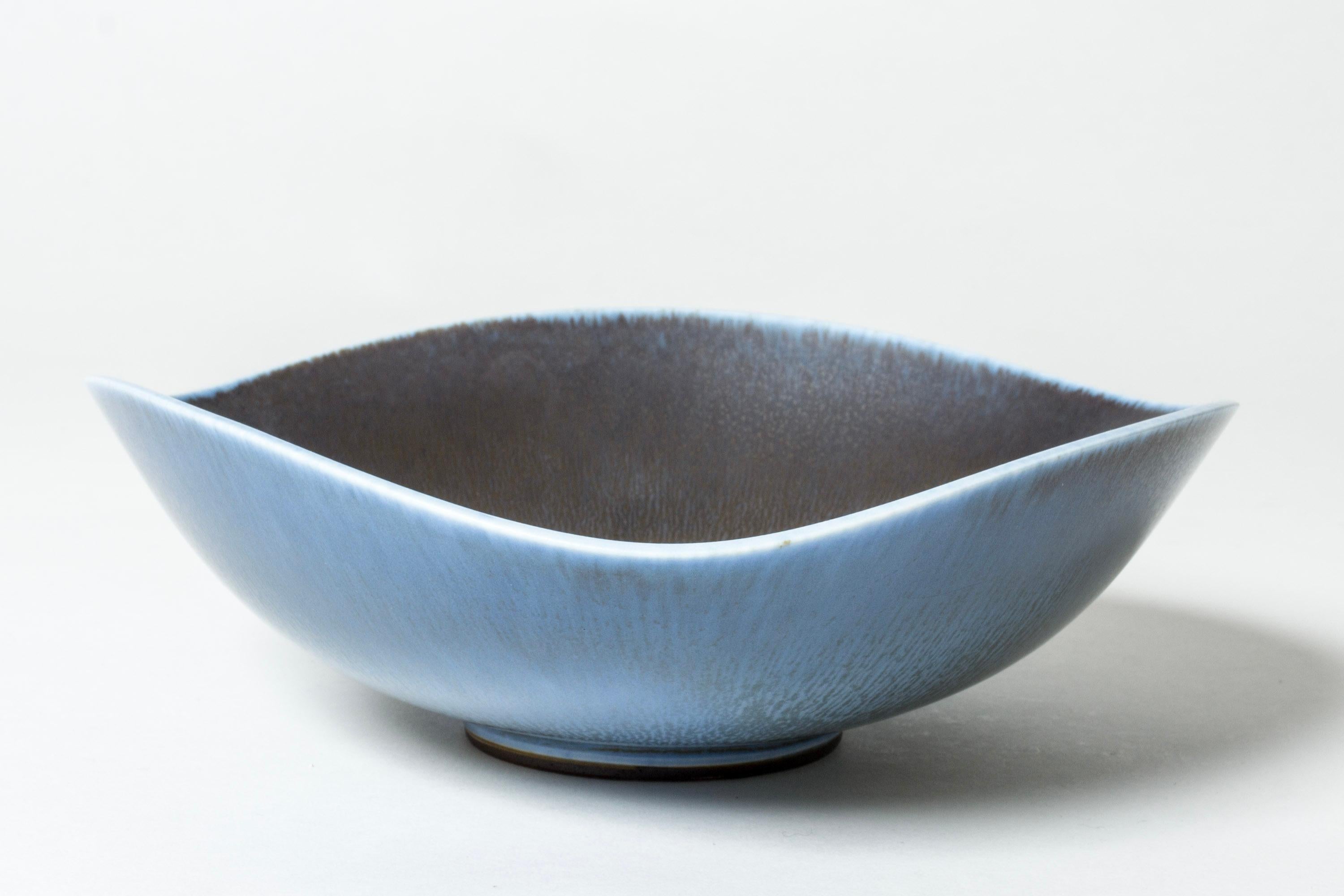 Large stoneware bowl by Berndt Friberg, with an undulating edge and rounded triangular form. Striking blue hare’s fur glaze, darker on the inside and lighter on the outside.

Berndt Friberg was a Swedish ceramicist, renowned for his stoneware