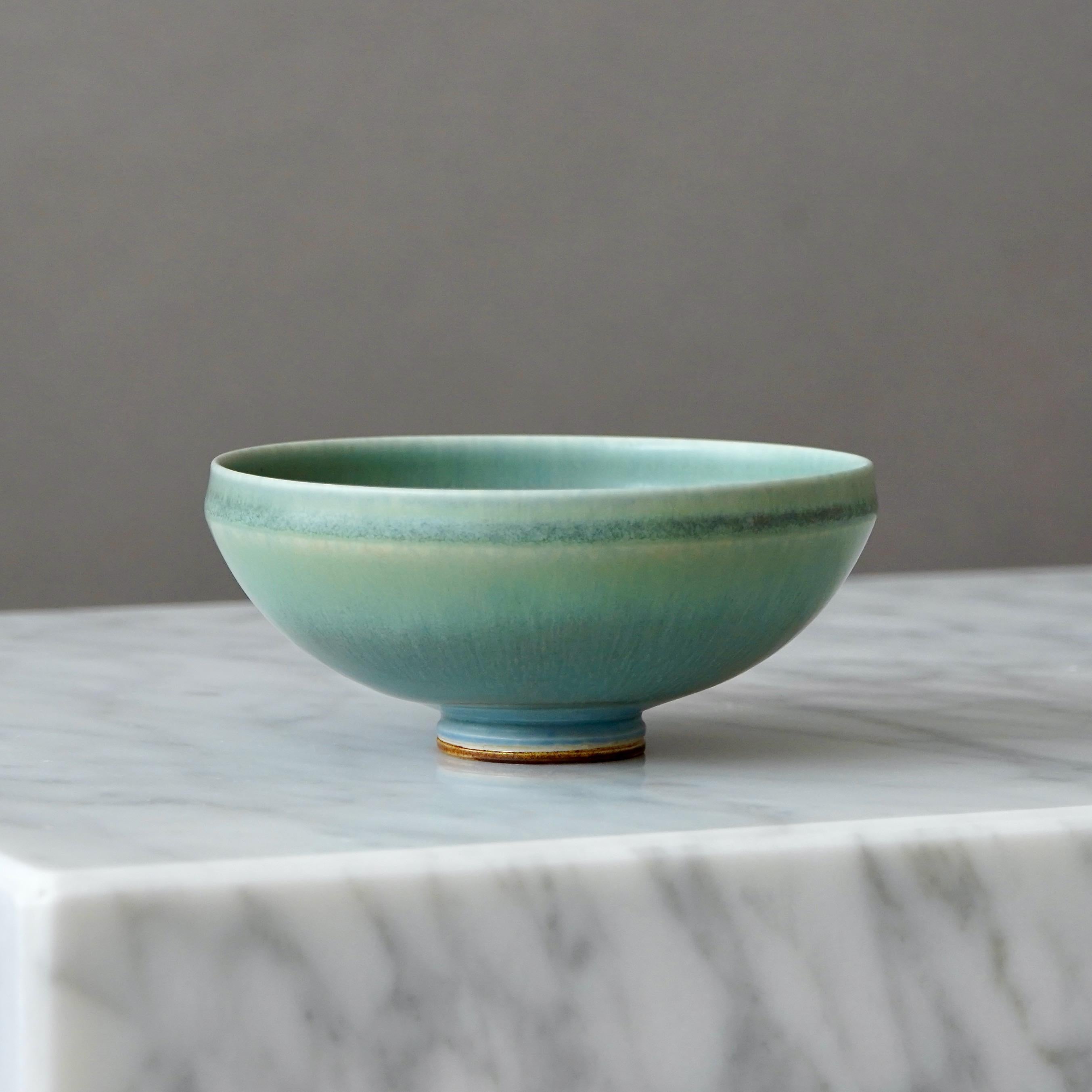 A beautiful stoneware bowl with amazing glaze.
Made by master thrower Berndt Friberg, in the artist's studio at Gustavsberg, Sweden, 1969.

Great condition. A small brown firing spot inside the bowl (pictured).
Incised signature 'Friberg' and