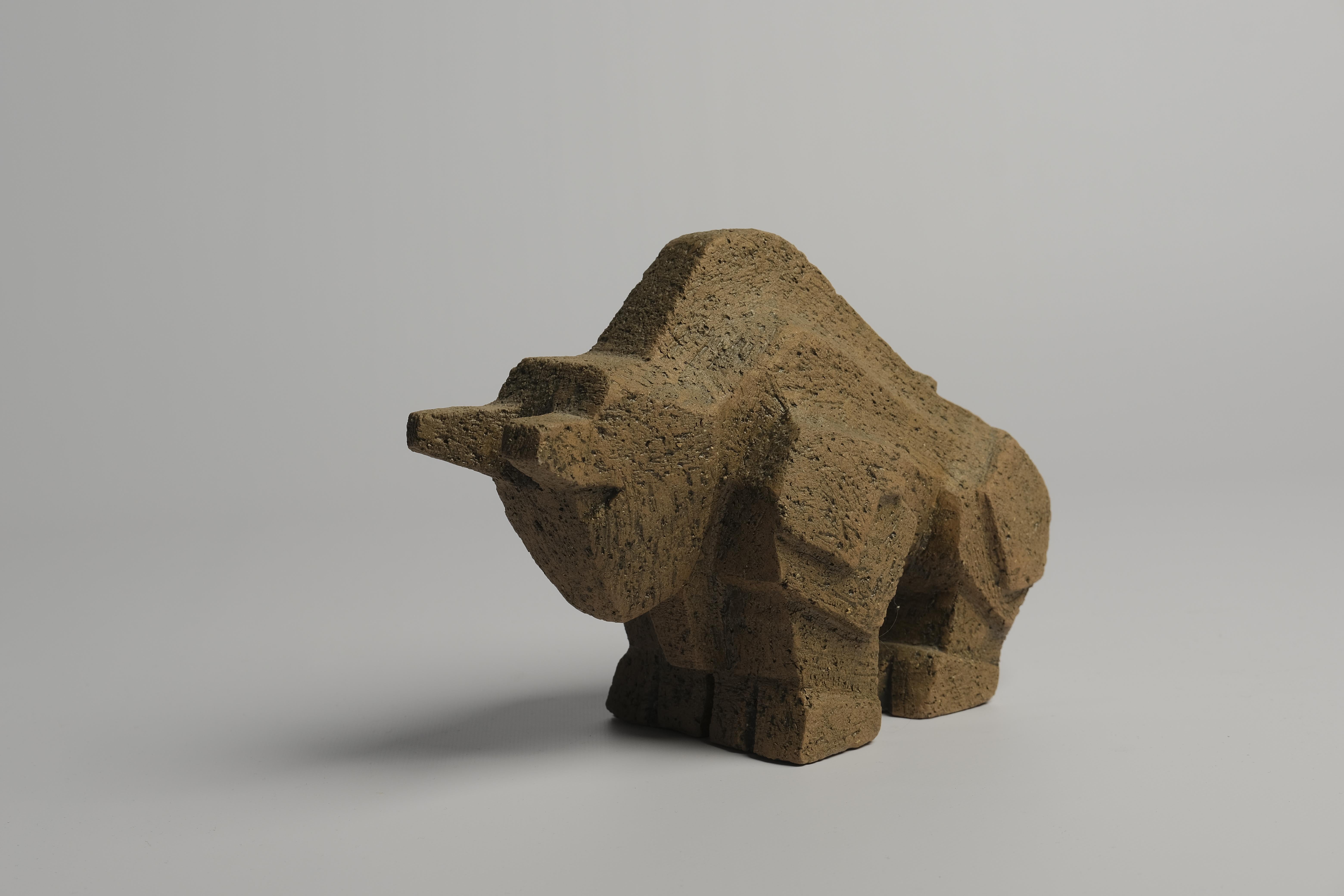 Striking brutalist style stoneware bull made by Lars Pagfeldt (1924-2001) for Pagfeldt Stengods, Sweden 1960s. Raw and rugged unglazed surface meets strong and brutal lines. Marked 55/100.