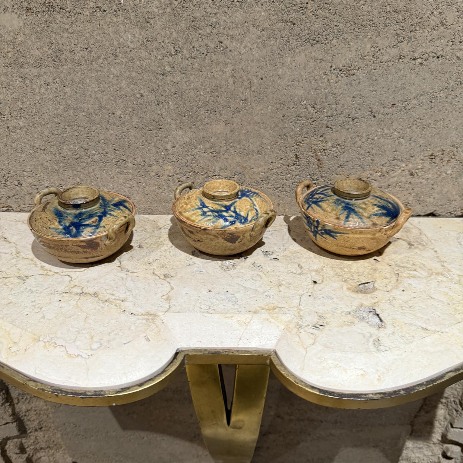 For your consideration, a set of three stoneware casserole dishes, made in Japan.
Stamped underneath: JAPAN. 

Dimensions: 2 H x 5 Diameter.

Please visit take a look at our listings, we have an amazing curated collection of hard to find items.

