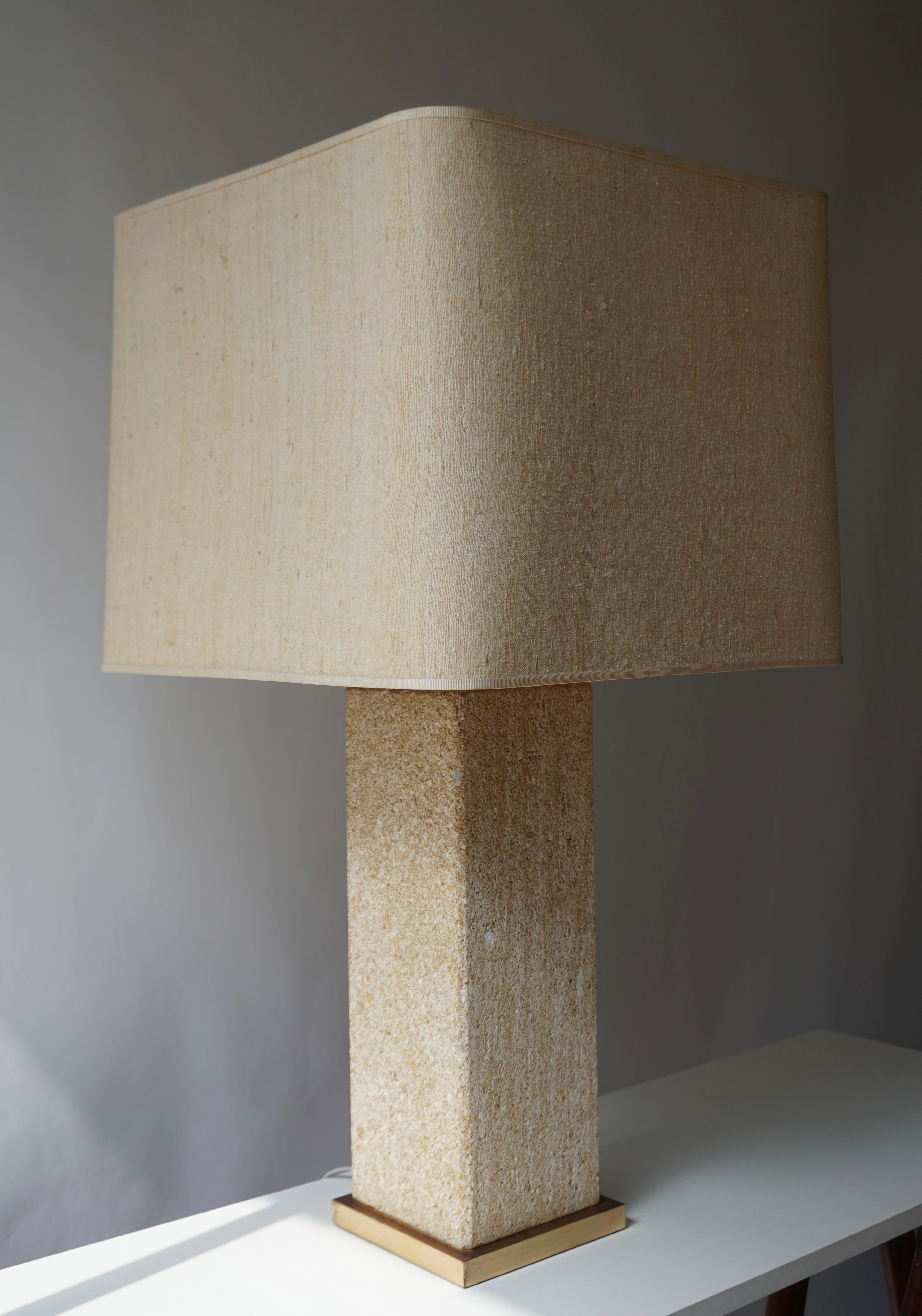 Elegant table lamp in pressed in stone wear ceramic, Italy. The bottom border is in brass and with original shade.

Measures: Height max 97 cm. (min 88cm)
Width base 15 cm.
Width shade 46 cm.
Weight 19 kg.
