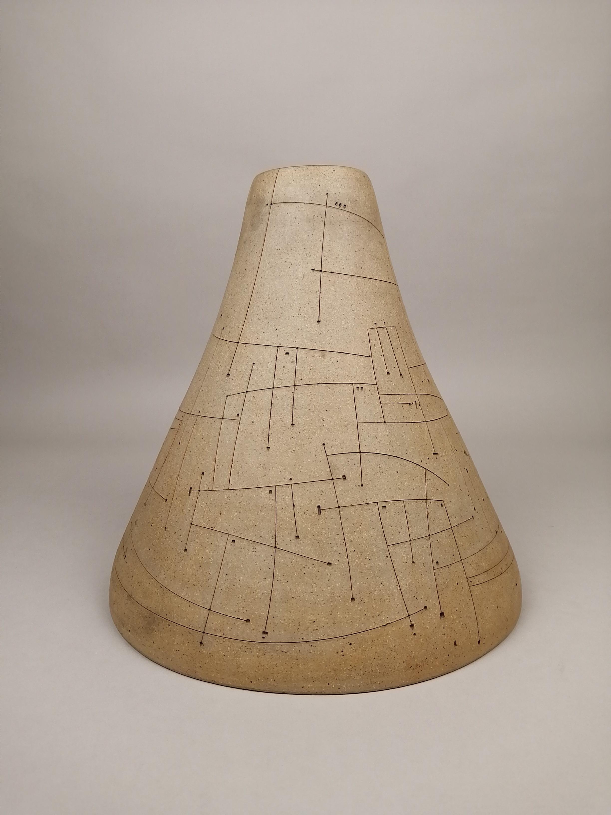 High temperature ceramic vessel by Gustavo Pérez. The cone-shaped vase has black interior and sand color exterior. The exterior is decorated with bas-relief black lines. Hand-crafted one-of-a-kind vase numbered 543 and dated 1992.

Gustavo Pérez