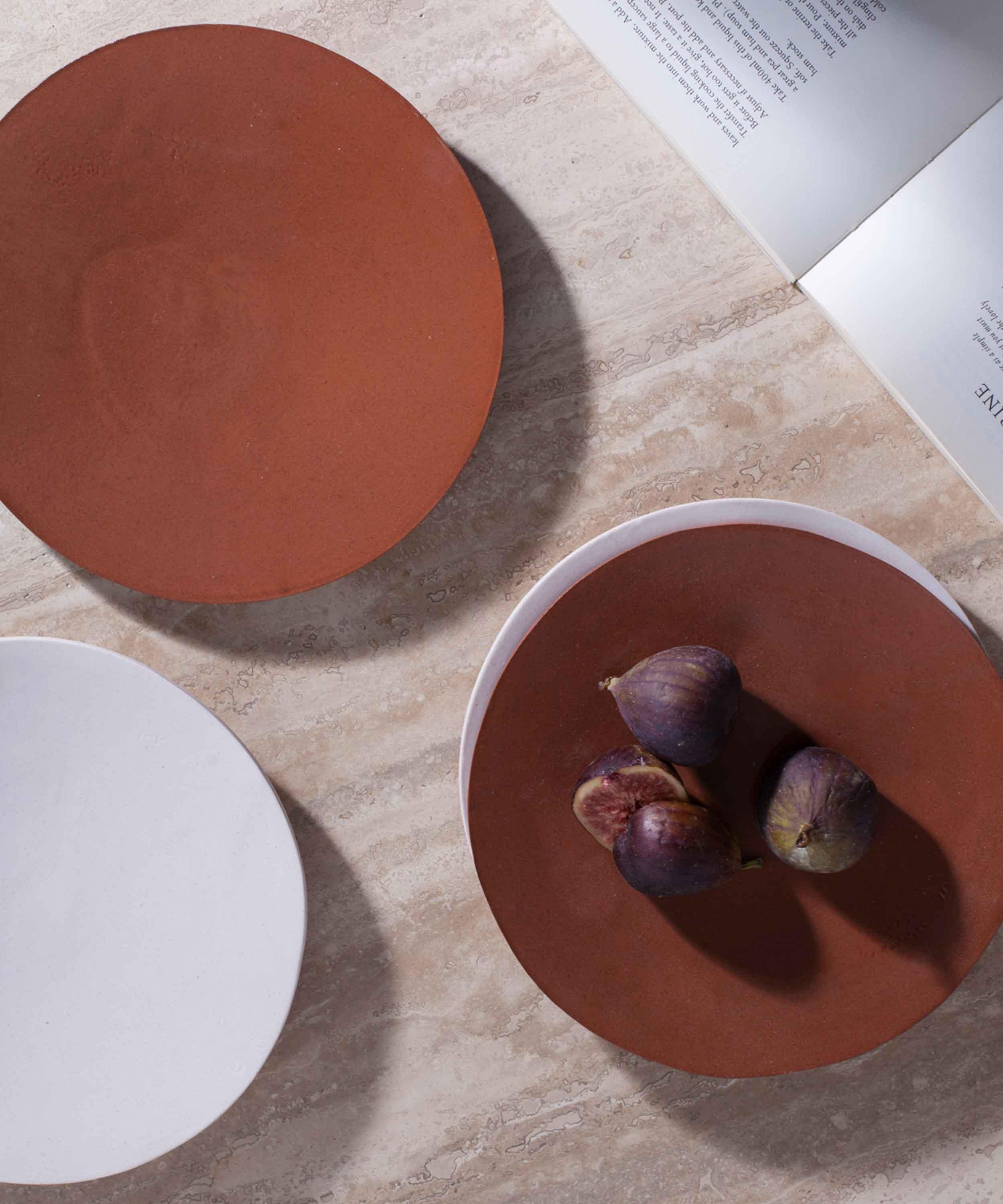 The pieces are slip cast in London, made from stoneware in small batches. The hand painted details around the rim of each item in the collection is created by glaze in a complimentary colour to the body of each piece.

CUSTHOM studio has developed