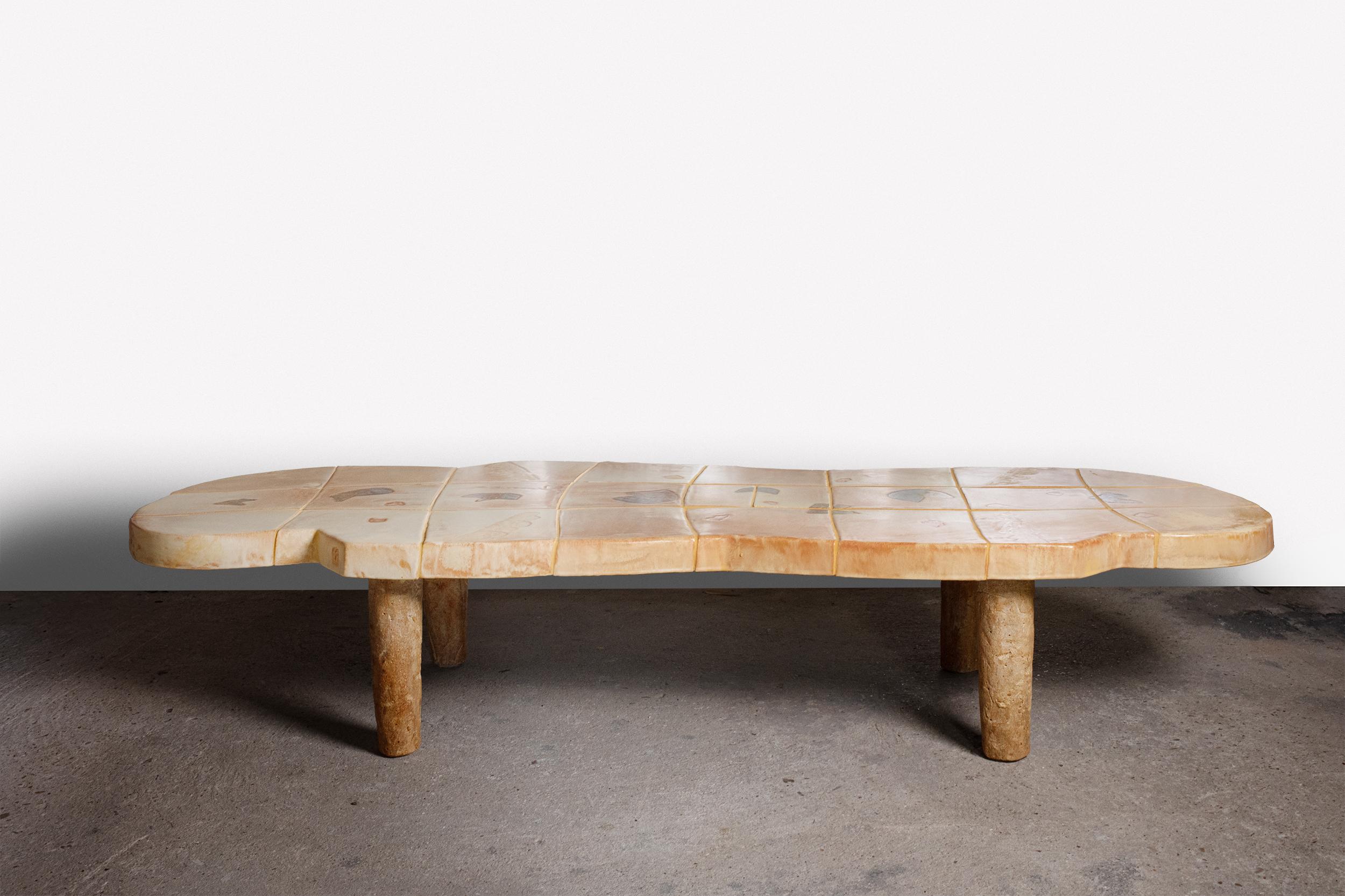 A ceramic coffee table with abstract glaze decoration by Jean-Pierre Viot.
Unique piece.
Signed.
The top is in ceramic and the bases are  in ceramic and in wood.
2024.
H : 34.5 x 64 x 179 cm  / 13.5' x 25' x 70.4' inches.