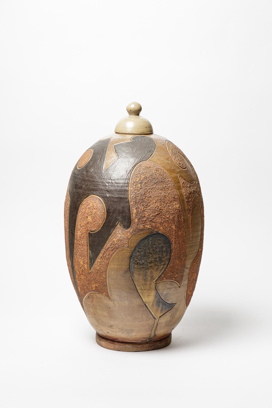 Stoneware covered pot by Georges Martin with geometrical decoration.
Artist monogram on the base. 
Circa 1970-1980.
Unique piece.
H : 21.2 x 10.6 x 10.6 inches.

