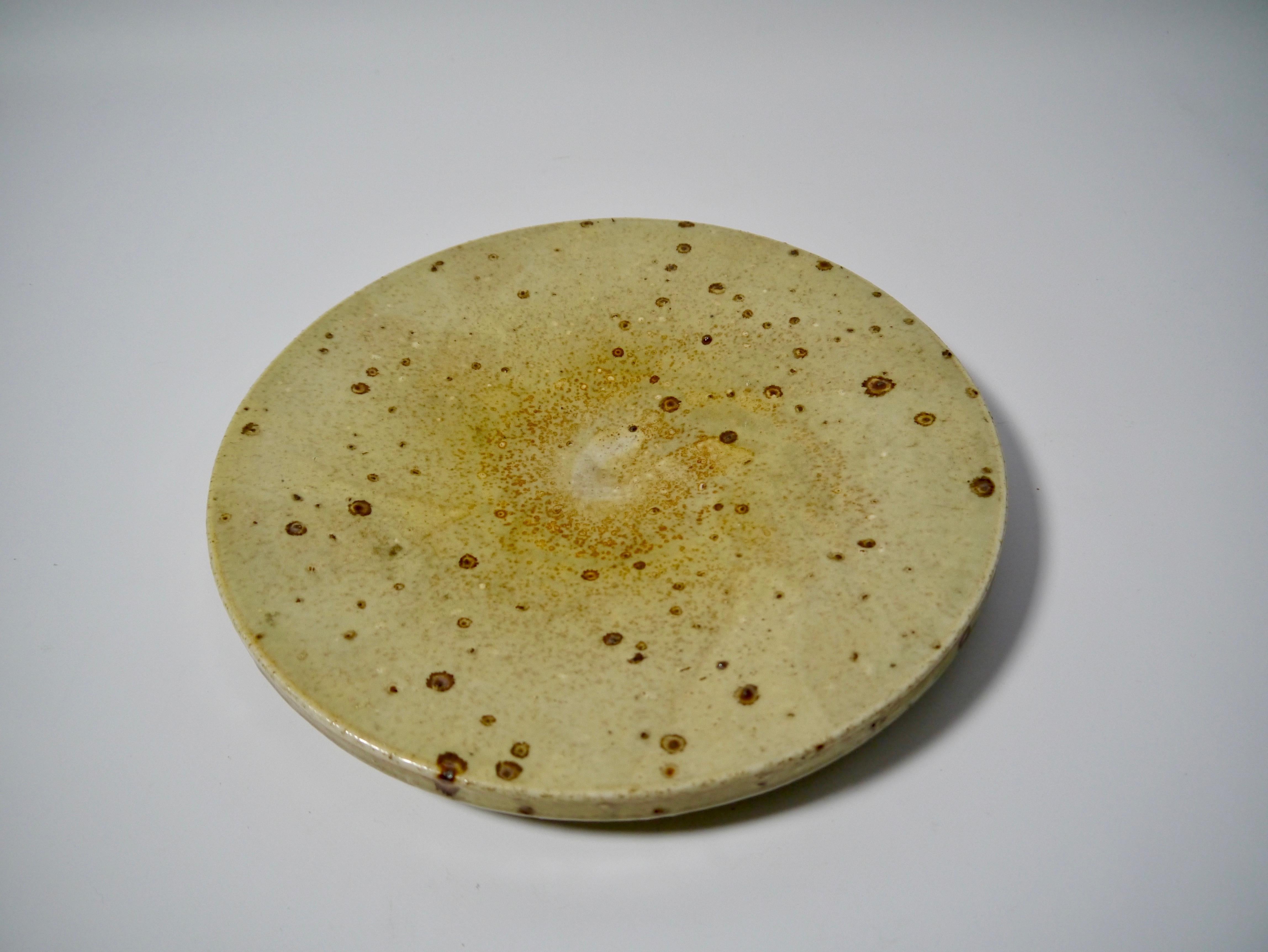 Shallow serving plate / dish / centerpiece designed by Marianne Westman for Rörstrand, Sweden, 1960s. Ceramic in an earthy colored, wabi-sabi raw glaze.