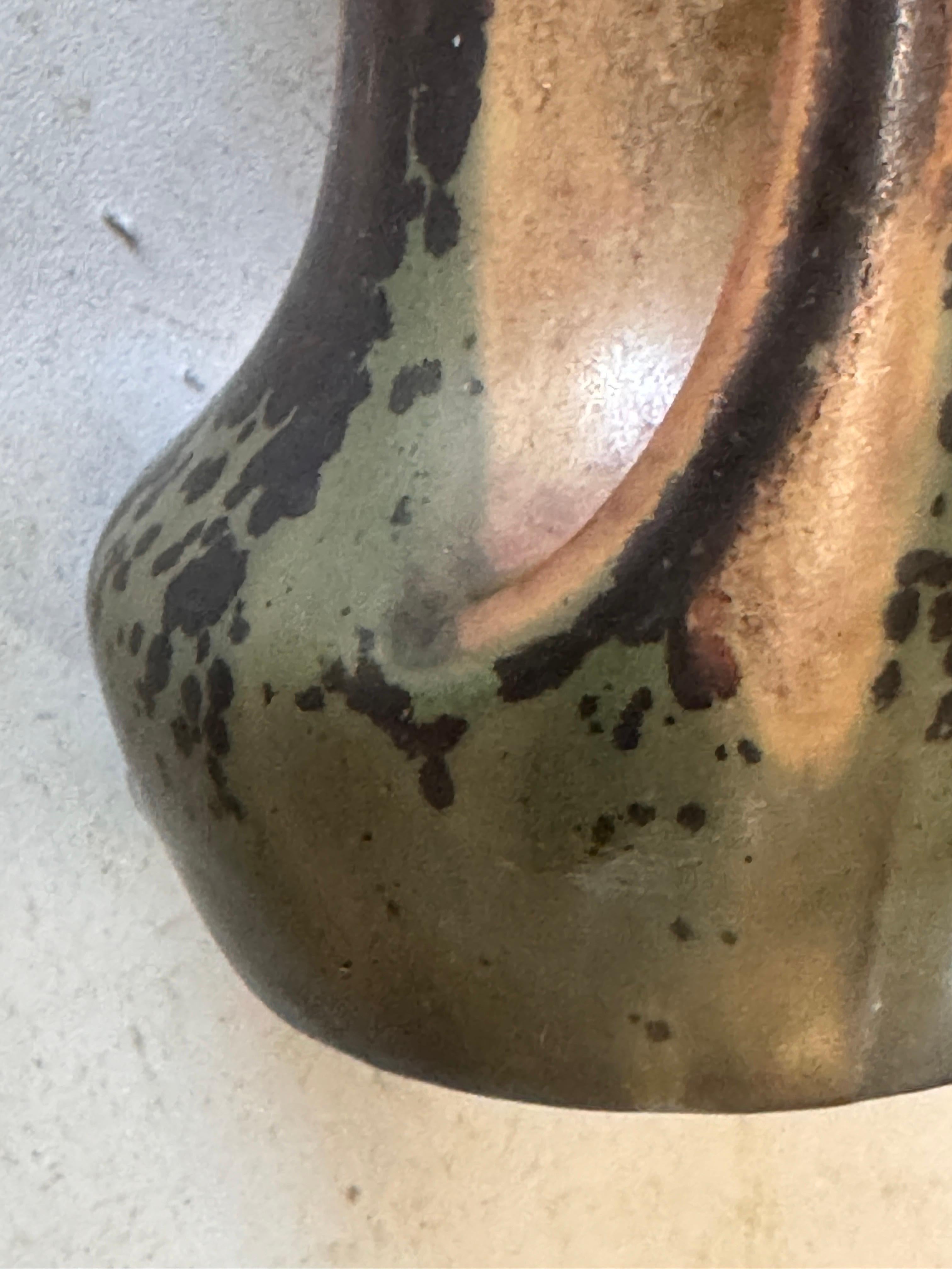 Vase in Sandstone, in a brown and Green color with iris inside. With a beautiful Glaze.  It has been made in France circa 1930.
