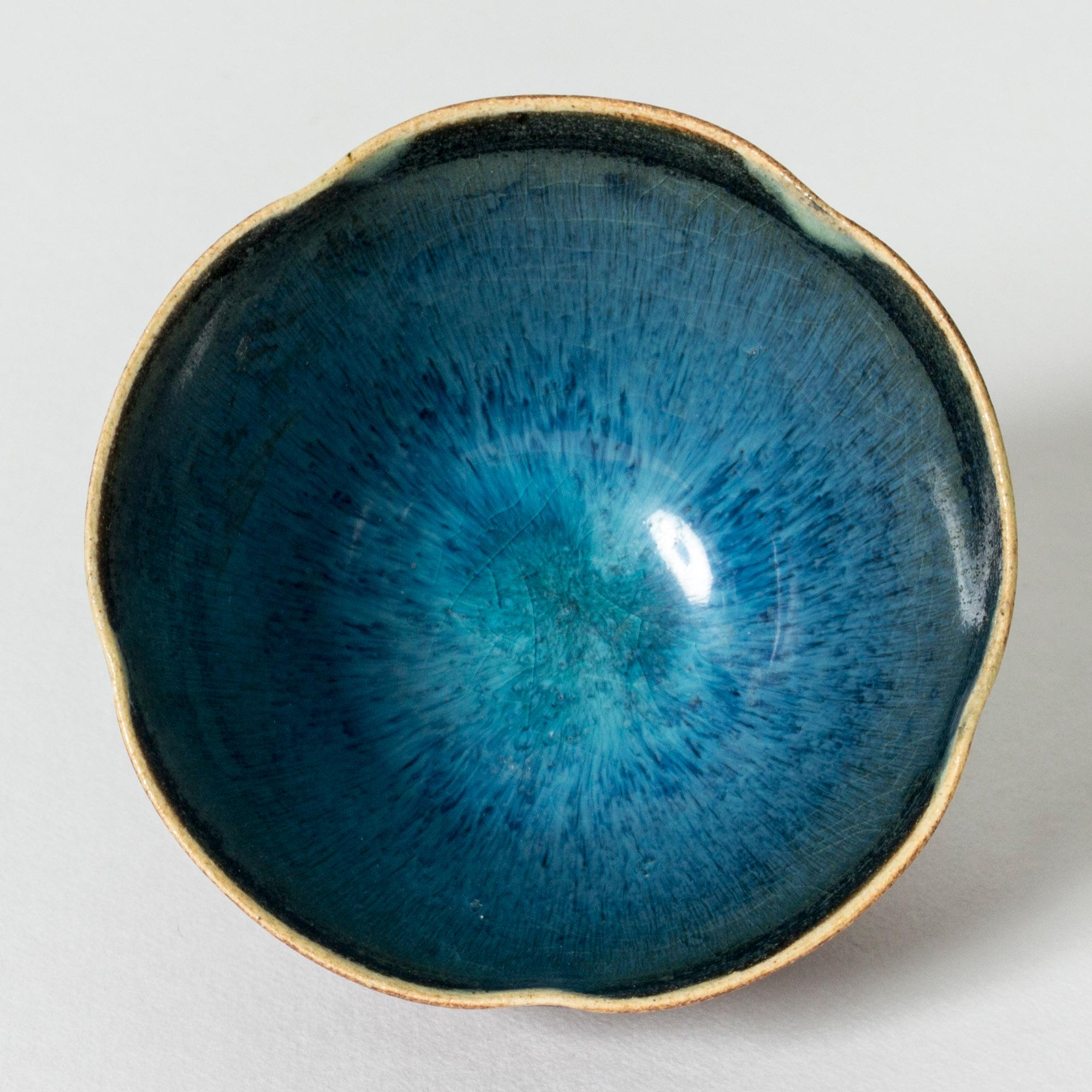 Lovely stoneware bowl by Wilhelm Kåge, in a small, sensitive form. Unglazed outside and inside in vibrant, glossy blue.

“Farsta” stoneware is recognized as being the best and most exclusive that has come out of Swedish arts and crafts. The series