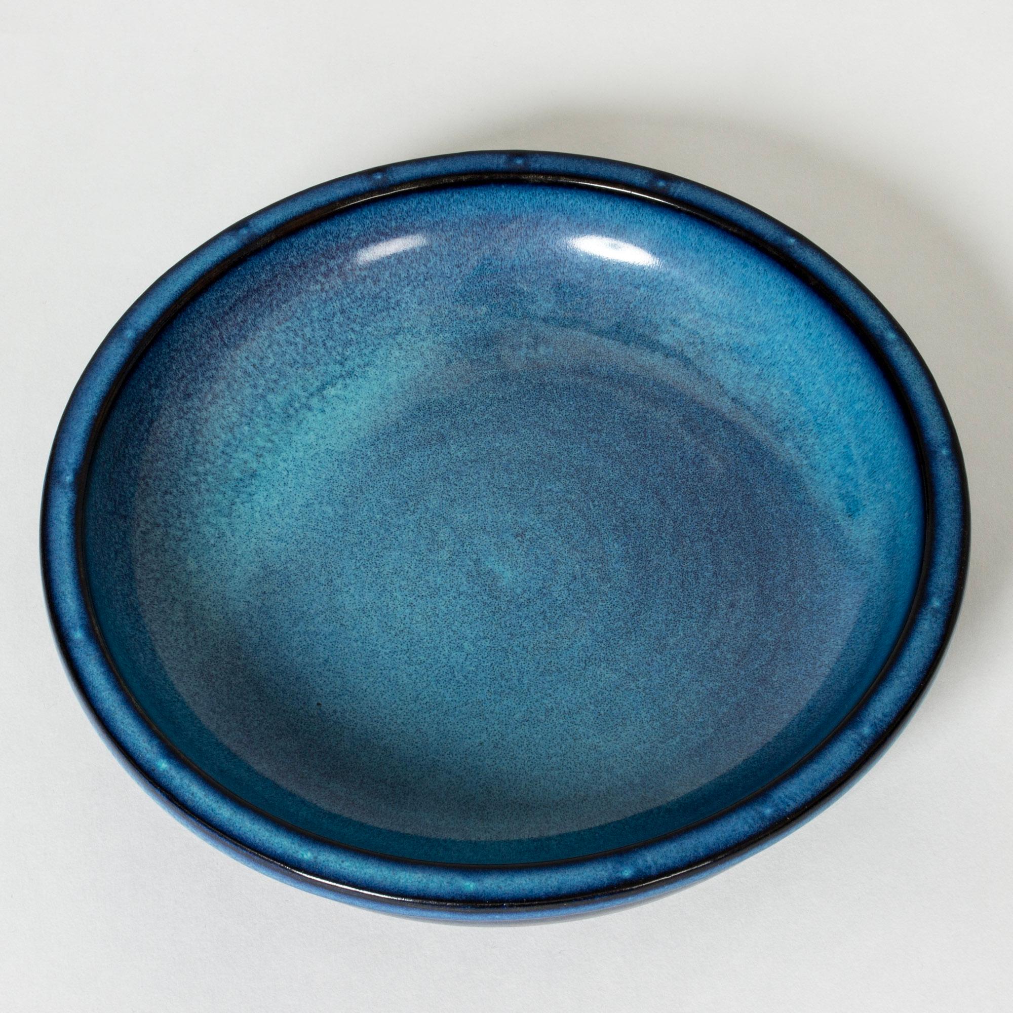 Low “Farsta” bowl or platter, made from stoneware in a smooth, thick form. Vibrant blue glaze.

“Farsta” stoneware is recognized as being the best and most exclusive that has come out of Swedish arts and crafts. The series represents the pinnacle of