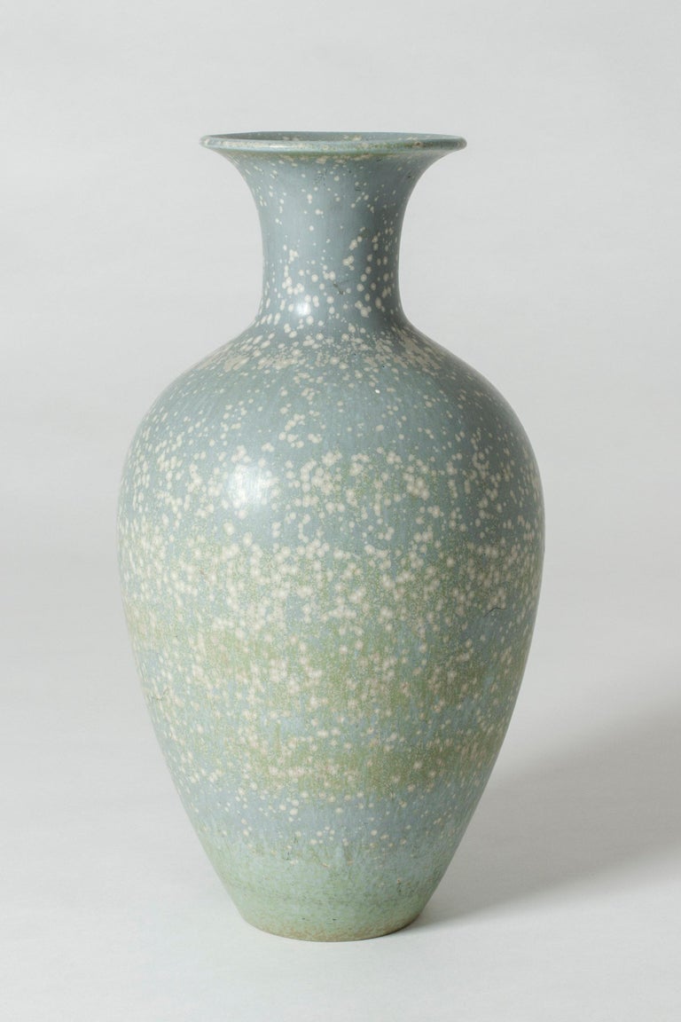 Large stoneware floor vase by Gunnar Nylund in a Classic shape. Beautiful icy blue “Mimosa” glaze with white speckles and greenish hues.