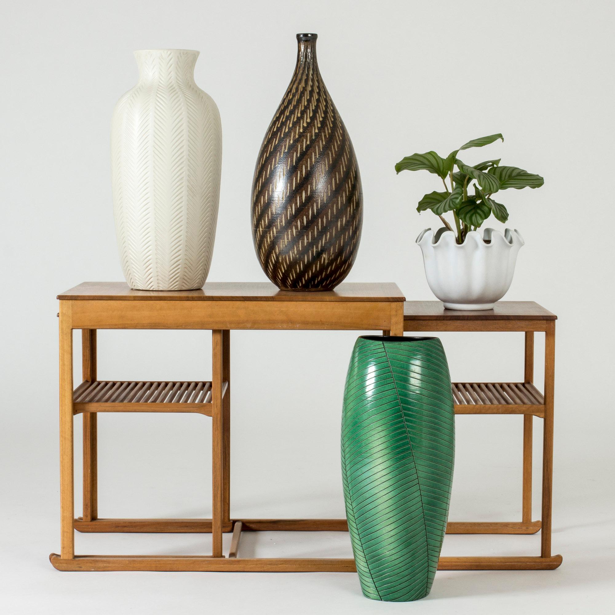 Stoneware floor vase from Uppsala-Ekeby, in an elegant slightly asymmetric form with a leaflike decor. Vibrant green color and graphic decor.