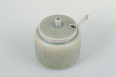 Stoneware jam jar with silver spoon. Palshus, Denmark, ca. 1960s.