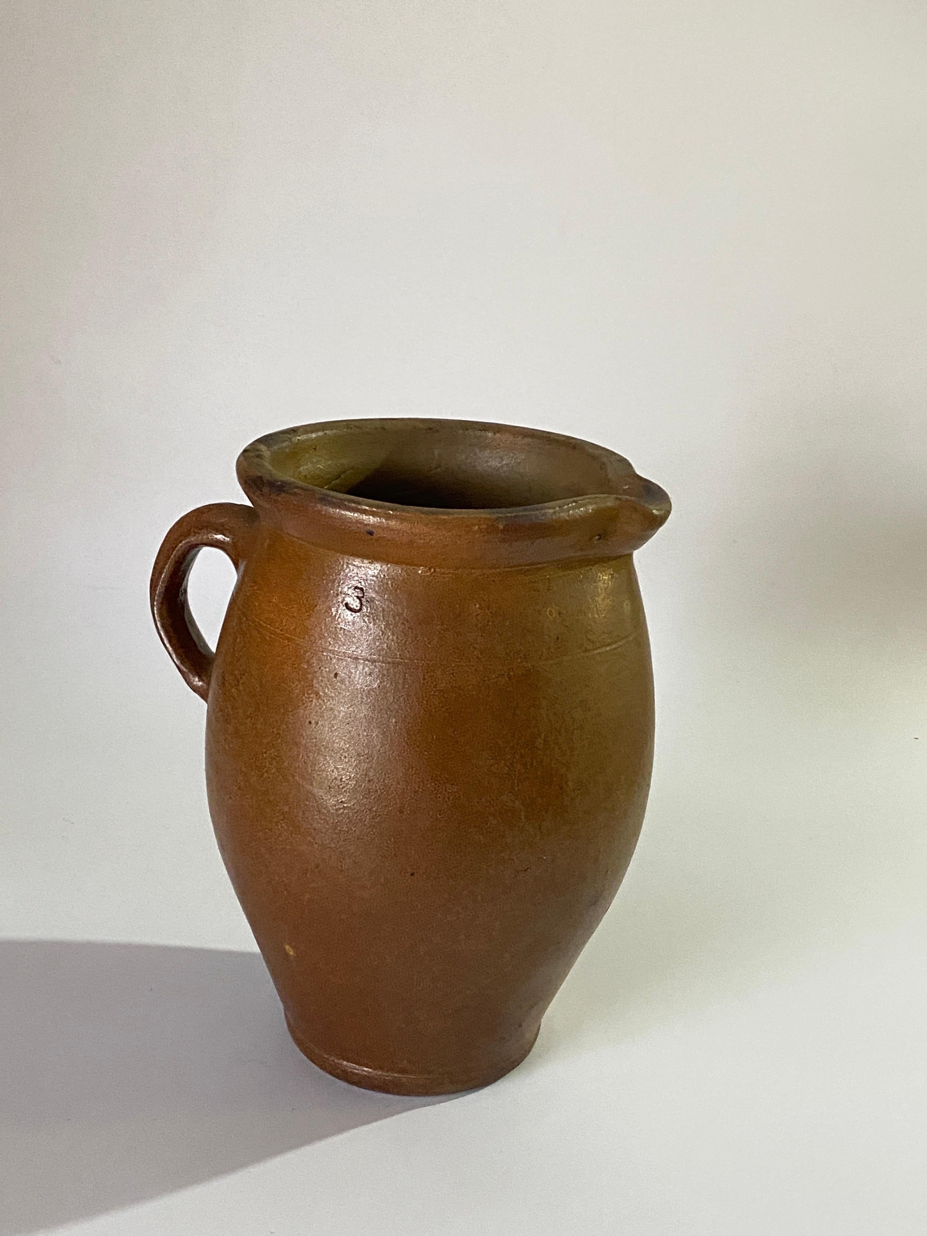 Jug or pitcher, with an exceptional patina. It's color with brown gives very pleasant contrasts. This Pitcher was created in France in the 1960s.