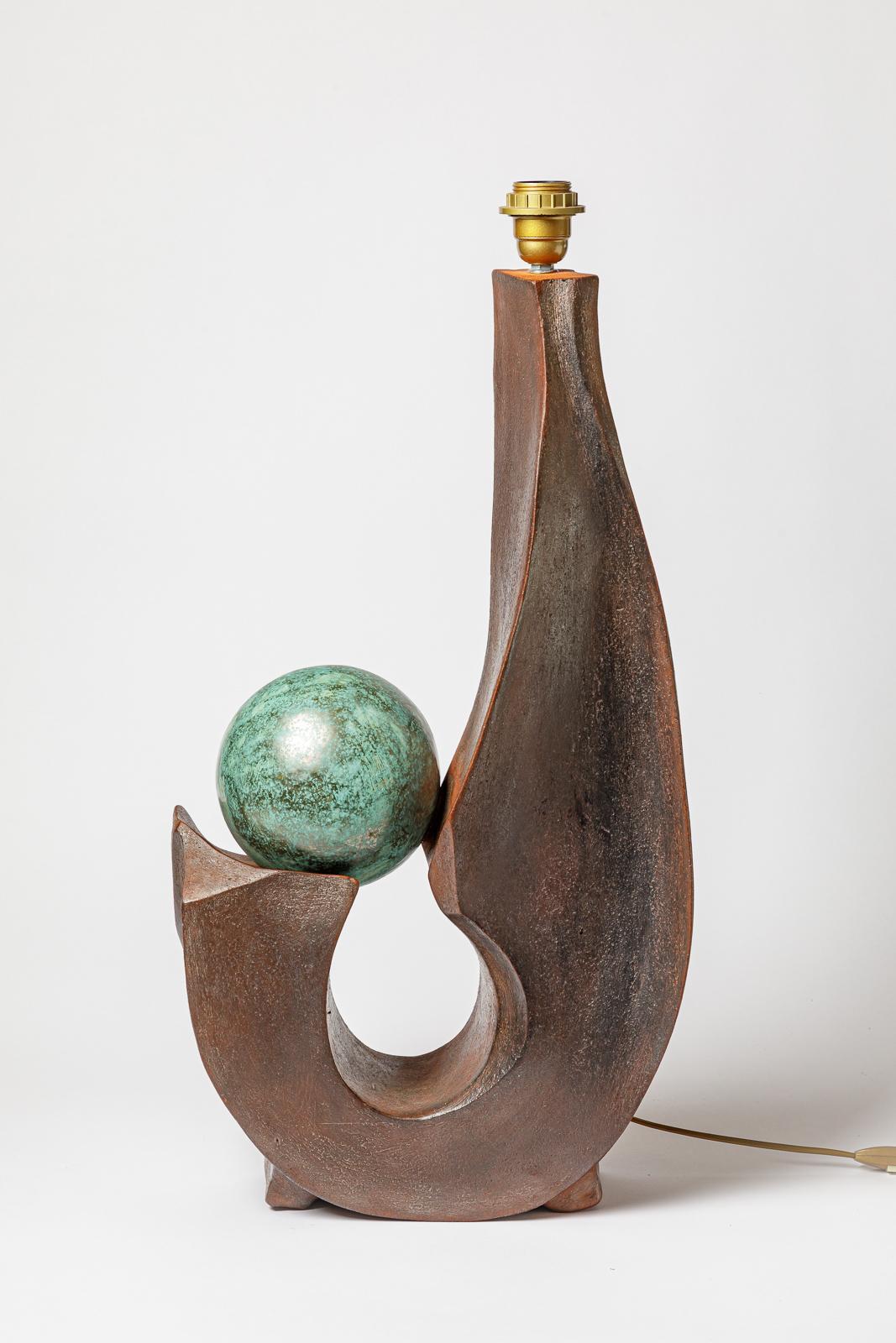 Stoneware lamp with geometric decoration by Georges Martin.
Artist monogram on the base. Circa 1970-1980.
H : 26.4 x 14.2 x 7.1 inches (ceramic only).
Sold with a European electrical system.
