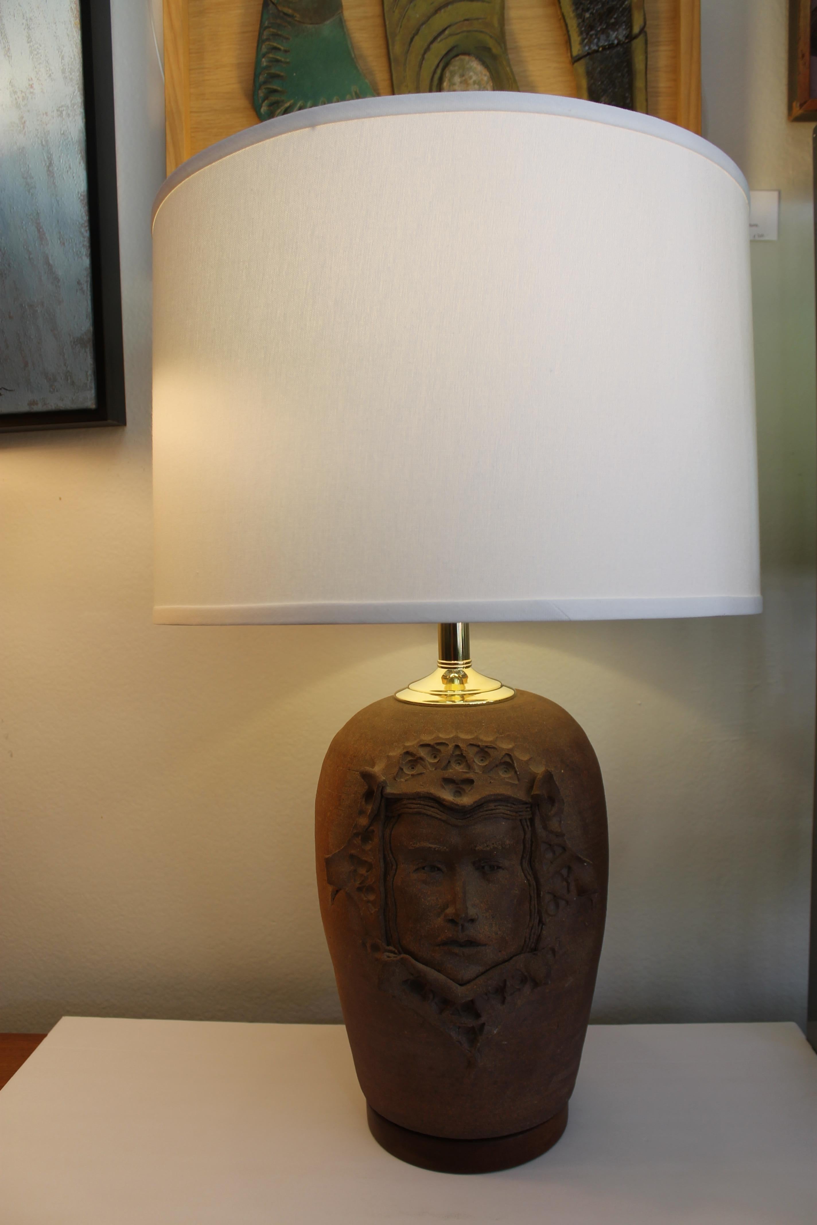 Ceramic lamp with a gothic face. Lamp measures 19