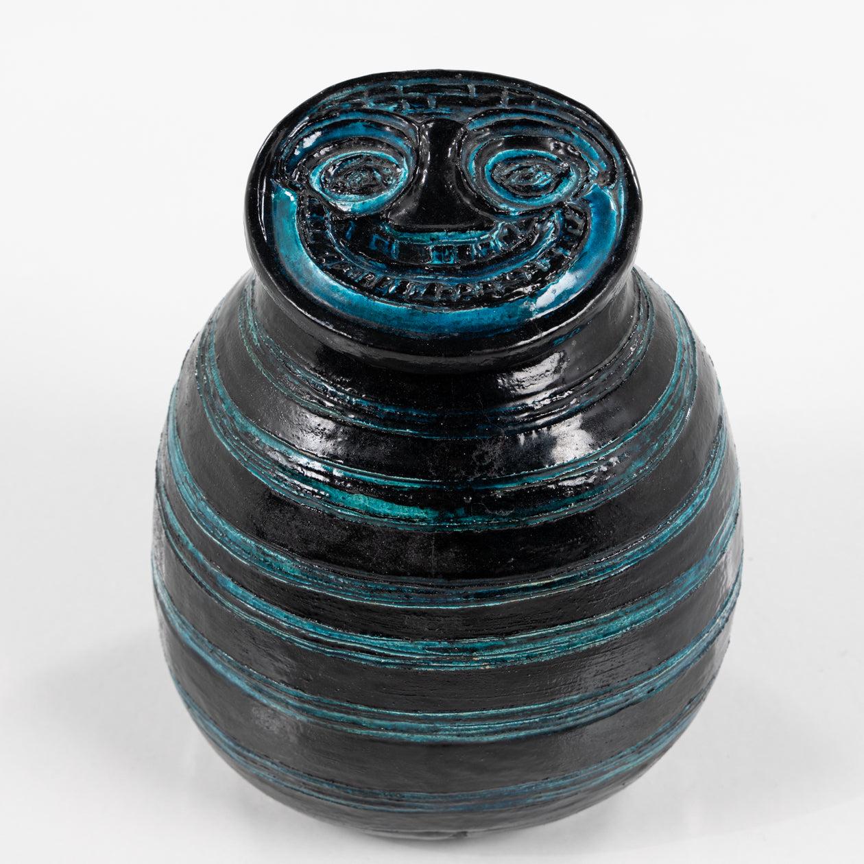Unique earthenware lidded jar with incisions and turquoise blue and black glaze. Signed 'Weggerby 62'.