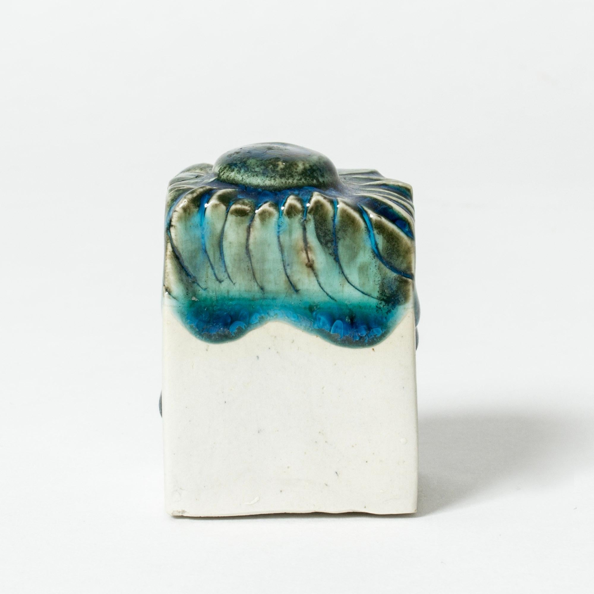 Small stoneware sculpture by Bengt Berglund in a cute, whimsical shape, ocean blue glaze on top, unglazed from the middle and down. 