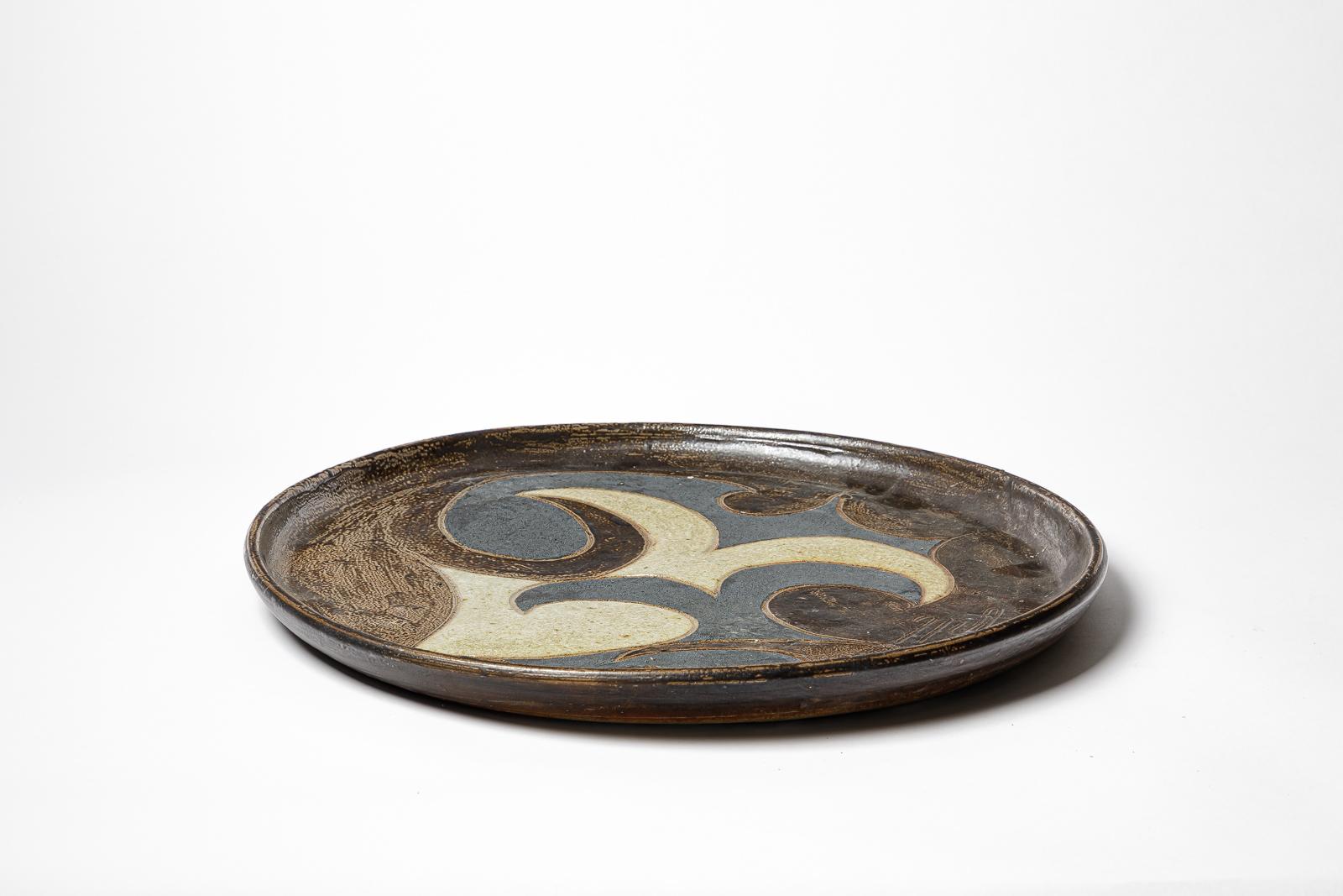 20th Century Stoneware sculptural plate by Georges Martin, circa 1970-1980. For Sale