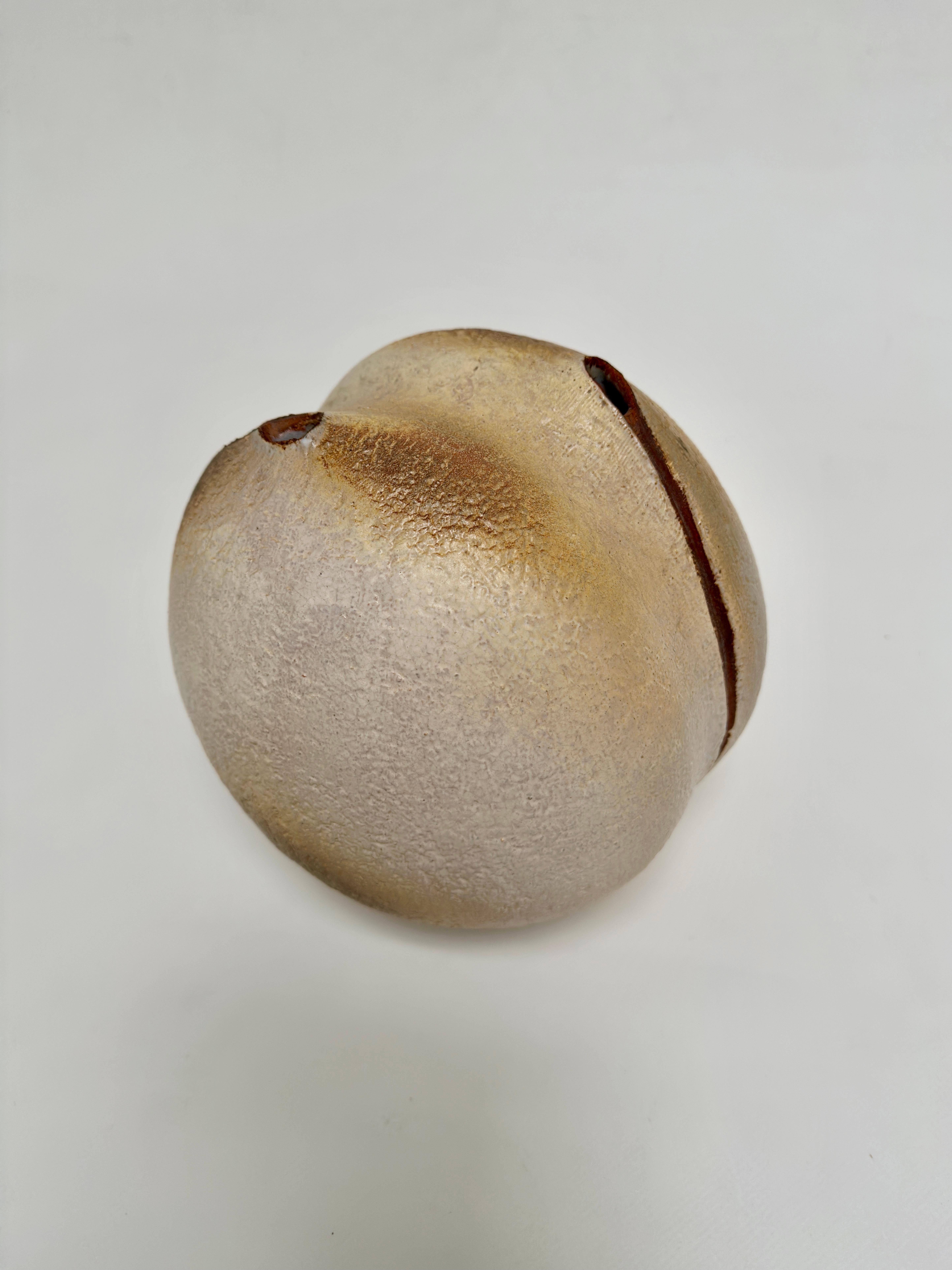 Astonishing Vase sculpture in textured sandstone evoking the generous shapes of a seed.
This sensual and dense piece is typical of the modernist creations of the Madoura studio in the 1970s.

Atelier Madoura is inseparable from the ceramic work of