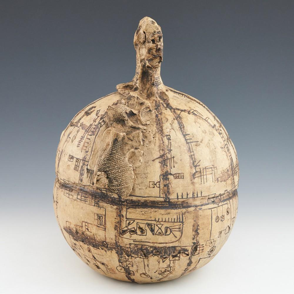 Stoneware Sphere Sculpture by Lies Cosijn, c1972

Mark Hill Comments : 
The body and parts of the neck are decorated with a wealth of geometric symbols applied with a brush by hand in a dark brown glaze that resembles ink. They resemble runic