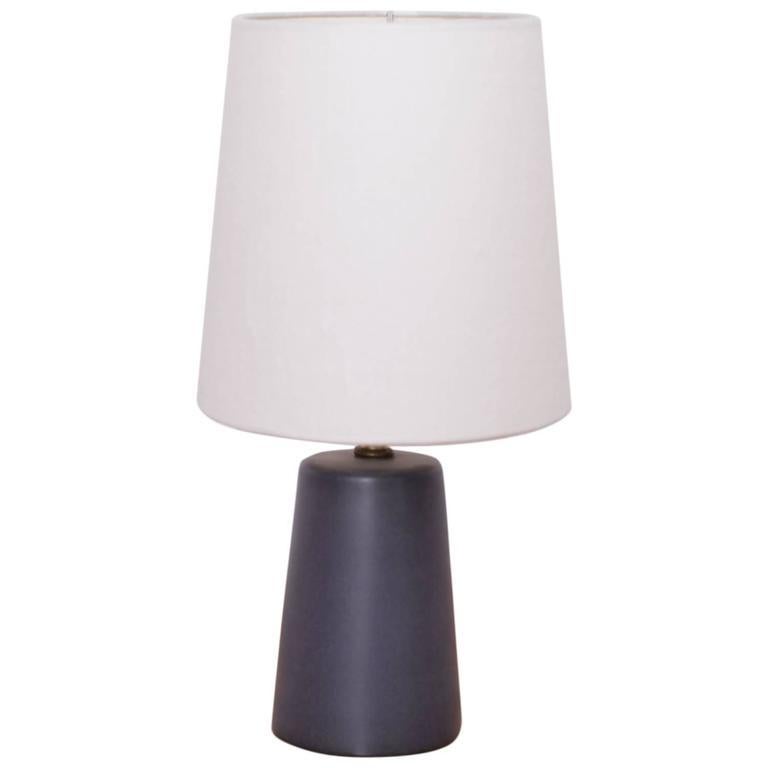 Wonderful dark grey stoneware table lamp n° 105 designed by Gordon Martz for Marshall Studios Inc. in excellent condition. No chips. New ivory colored linen shade. More lamps by Gordon Martz in different styles are available.
To be on the safe side,