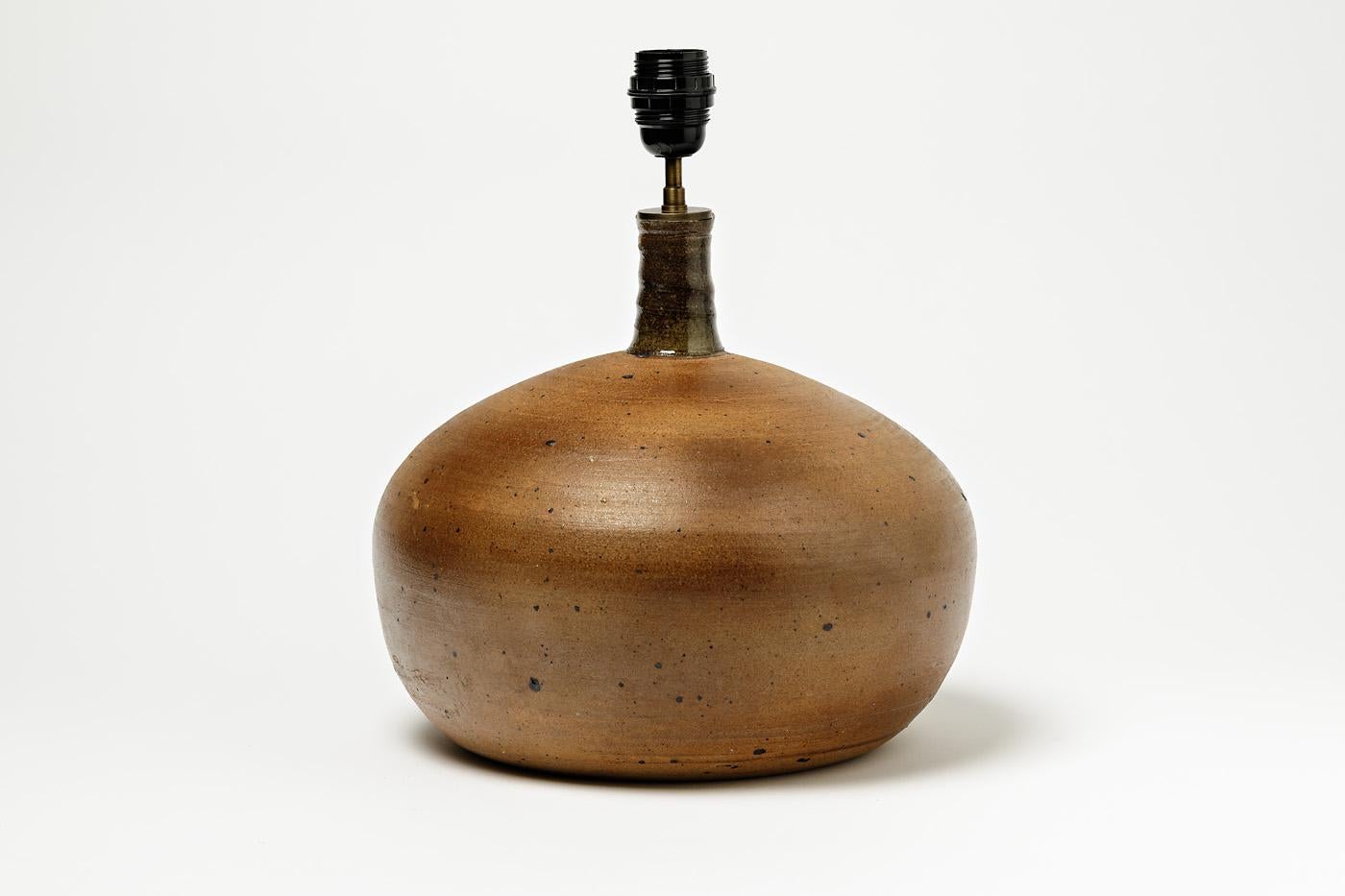 A stoneware table lamp by Pierre Digan to La Borne.
Signed at the base.
Perfect conditions,
circa 1970.
Dimensions: 29 x 29 cm / 11' 1/2 x 11' 1/ 2 inches (without electrical system)
 39 x 29 cm / 15' 1/3 x 11' 1/2 inches (with electrical